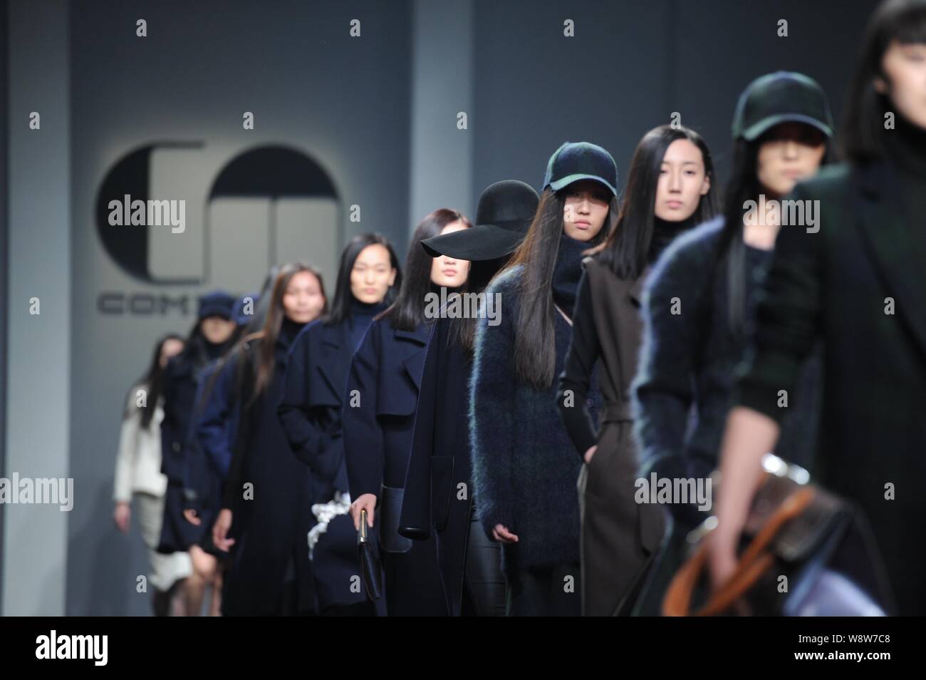 Models display new creations designed by Chinese model Lv Yan at Comme ...