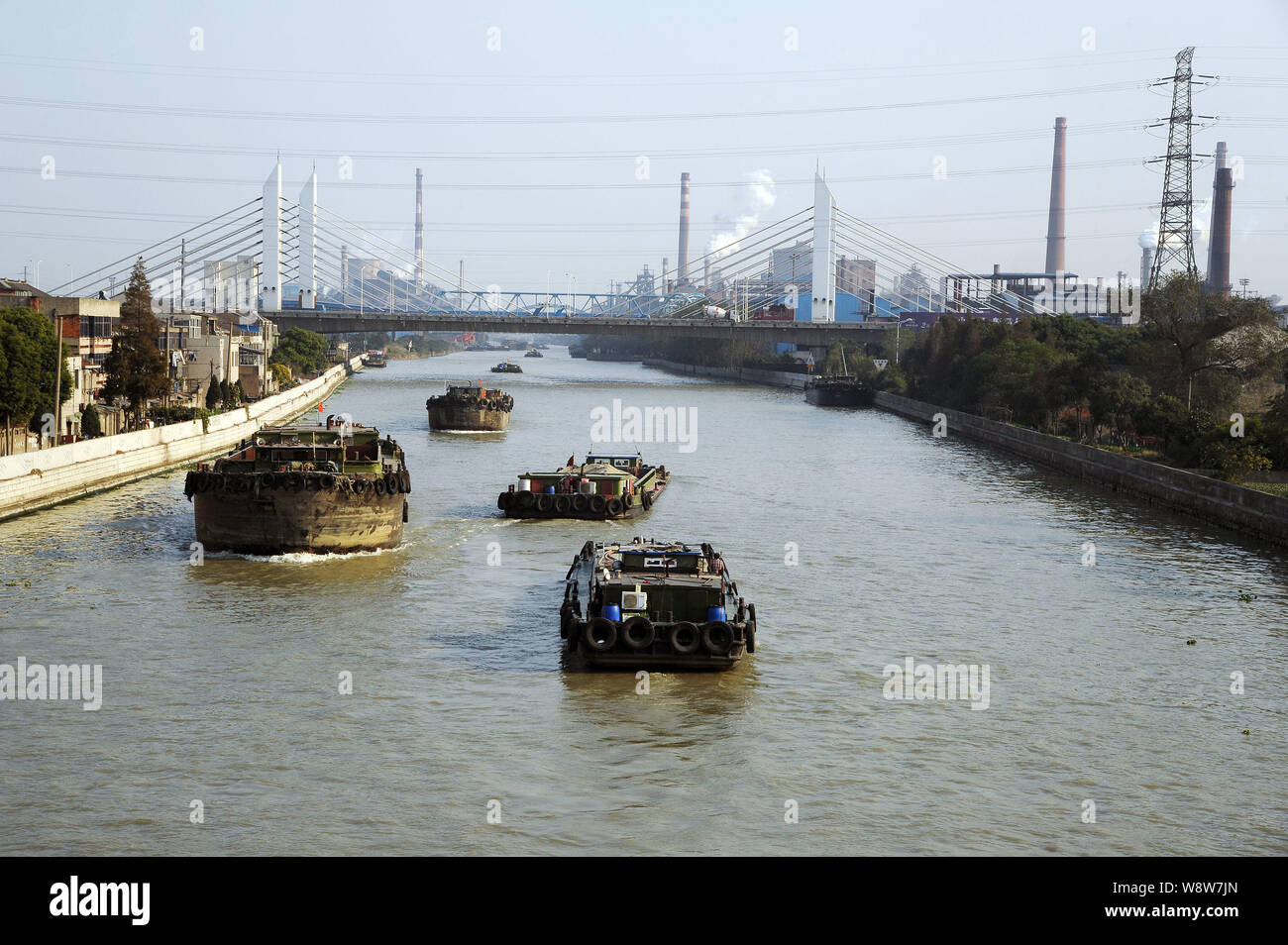 --FILE--Boats sail along the Grand Canal in Changzhou city, east Chinas Jiangsu province, 18 November 2013.   Chinas Grand Canal, the longest artifici Stock Photo