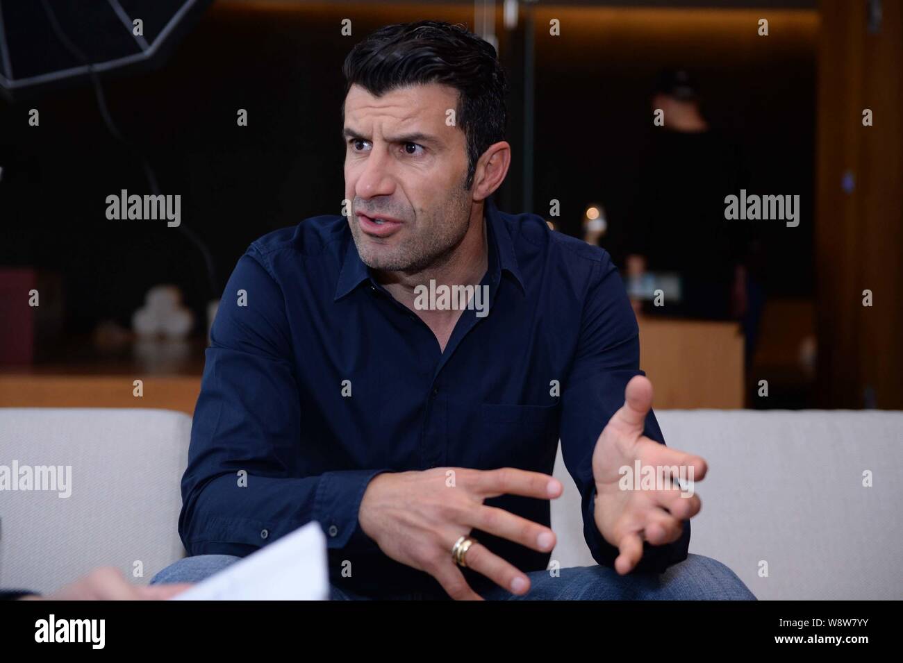 Portuguese football star Luis Figo speaks at an interview by BAZAAR Mens Style magazine in Beijing, China, 12 March 2014.   Portuguese football star L Stock Photo