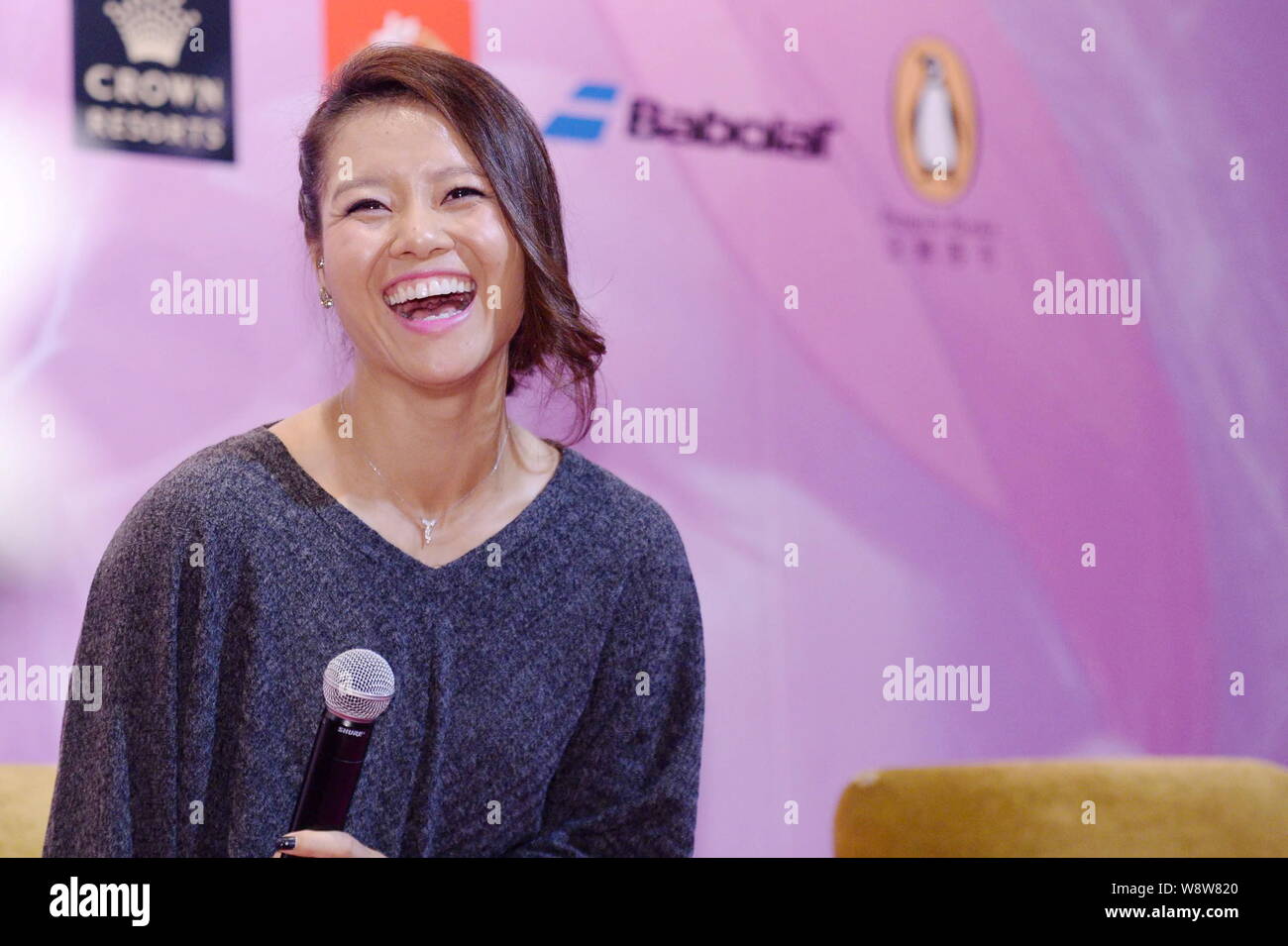 --FILE--Chinese tennis star Li Na laughs during a press conference for her new book in Beijing, China, 22 February 2014.   China's two-time Grand Slam Stock Photo
