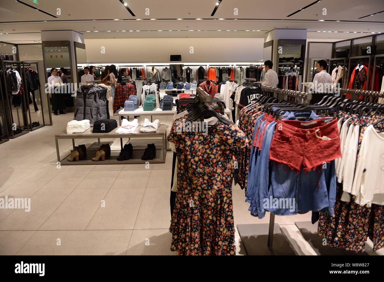 FILE--Guests visit the reopened fashion store of Zara during a reopening  reception at The Place shopping mall in Beijing, China, 12 September 2013  Stock Photo - Alamy