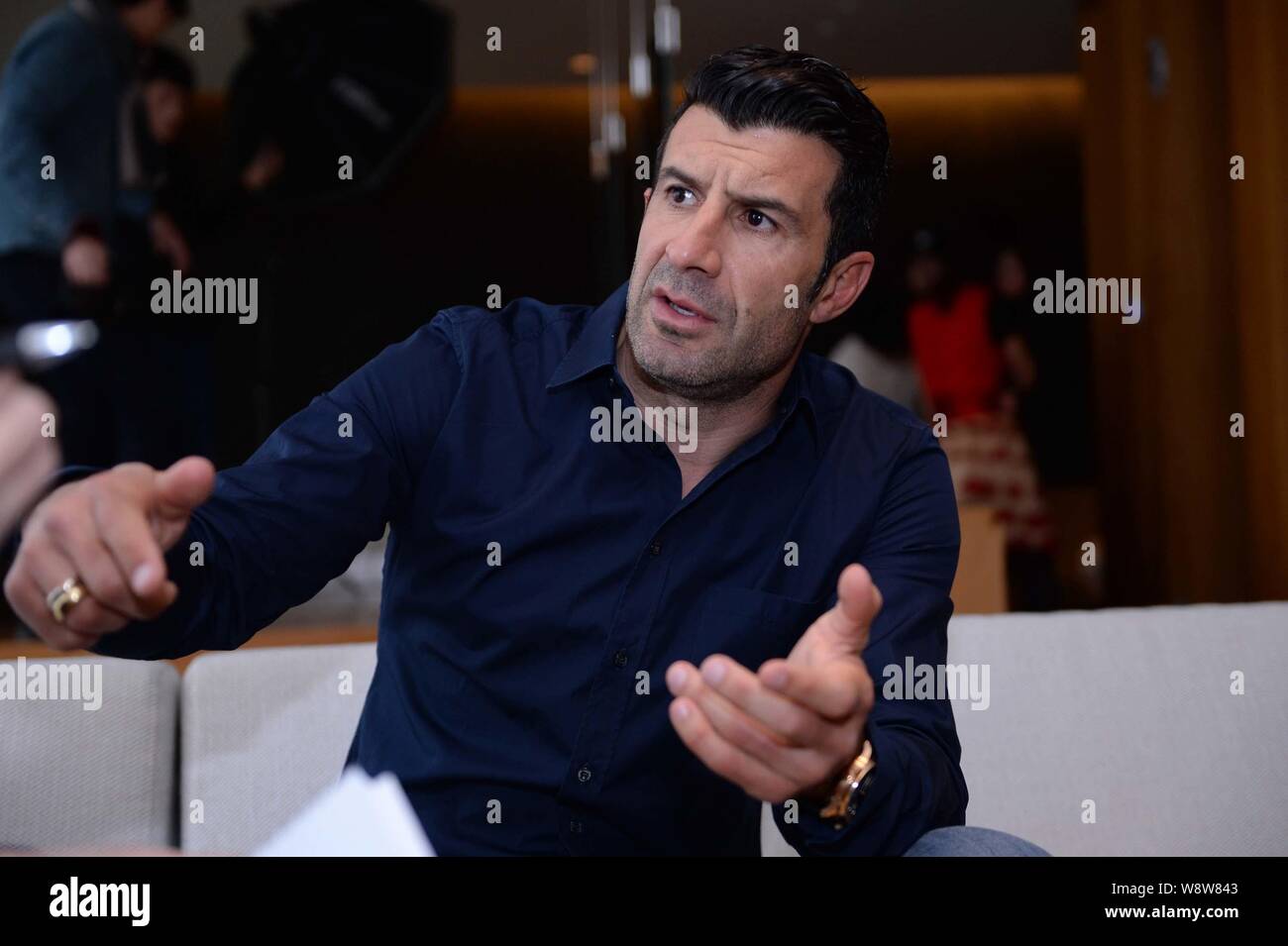 Portuguese football star Luis Figo speaks at an interview by BAZAAR Mens Style magazine in Beijing, China, 12 March 2014.   Portuguese football star L Stock Photo