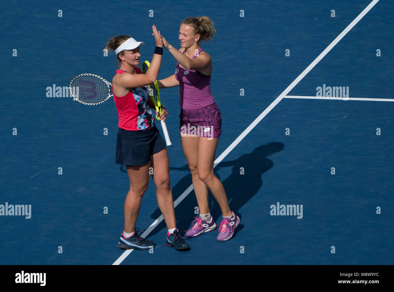 Toronto, Canada. 11th Aug, 2019. Barbora Krejcikova (L) and Katerina Siniakova of the Czech Republic celebrate victory after winning the women's doubles final against Anna-Lena Groenefeld of Germany and Demi Schuurs of the Netherlands at the 2019 Rogers Cup in Toronto, Canada, Aug. 11, 2019. Credit: Zou Zheng/Xinhua/Alamy Live News Stock Photo