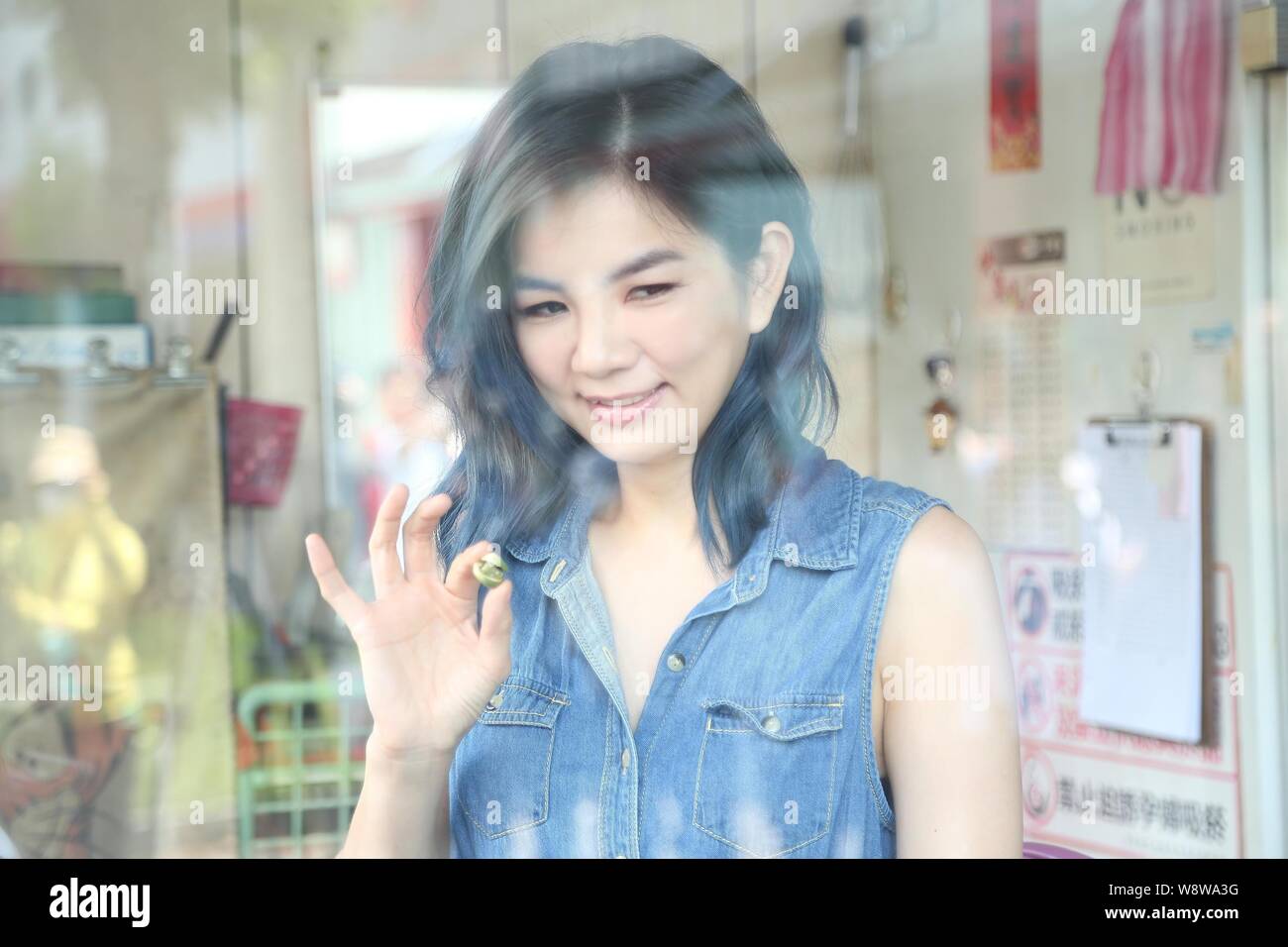 Ella Chen Of Taiwanese Girl Group S H E Poses With An Areca Nut As