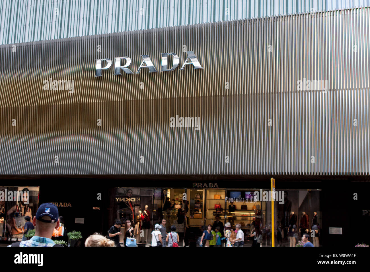 --FILE--Pedestrians walk past a boutique of Prada in Hong Kong, China, 23 August 2014.     Italian fashion group Prada SpA, which has been struggling Stock Photo