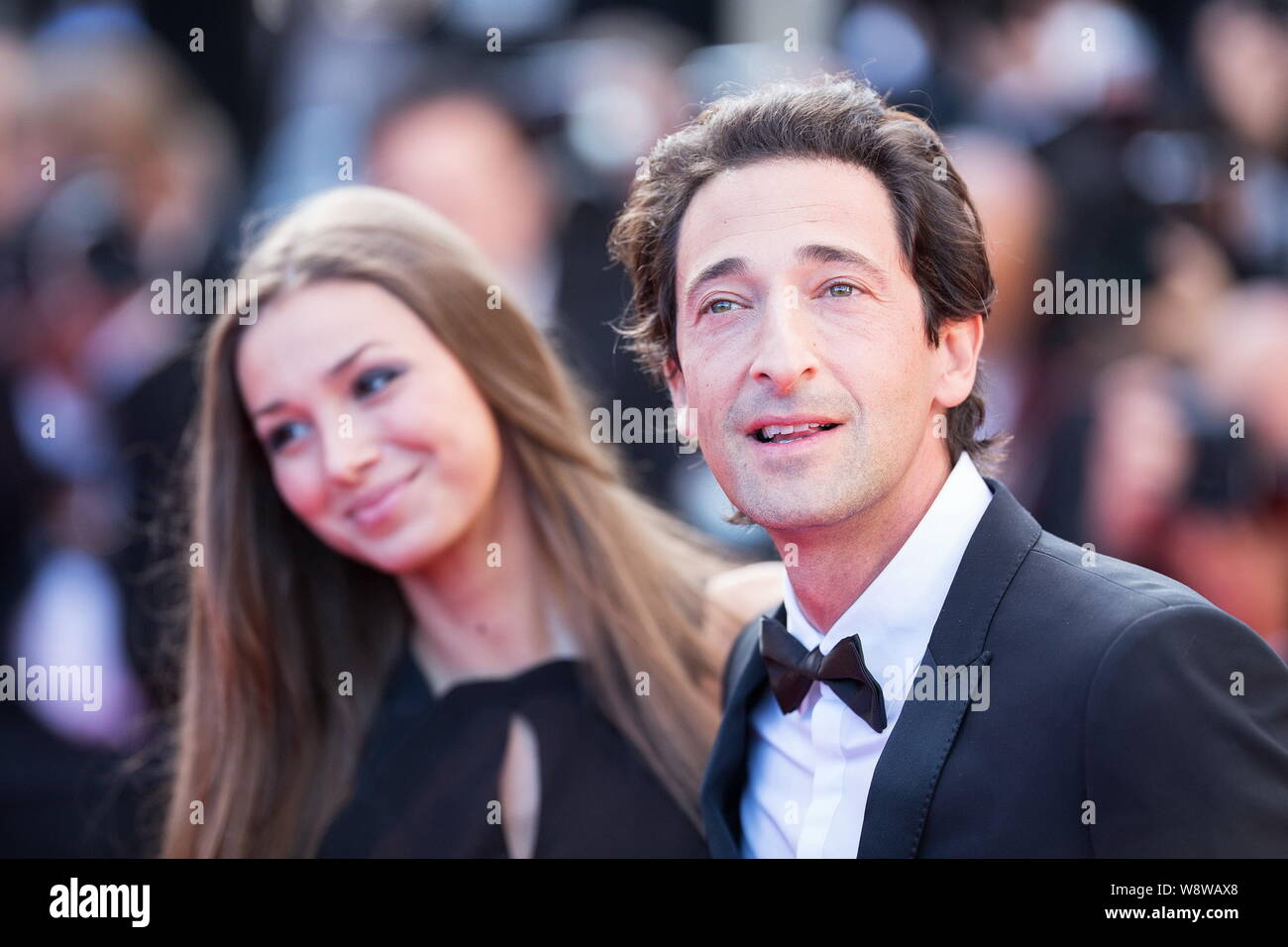 American actor Adrian Brody, right, and his girlfriend Lara Lieto pose for photos as they arrive at the red carpet for the closing ceremony of the 67t Stock Photo