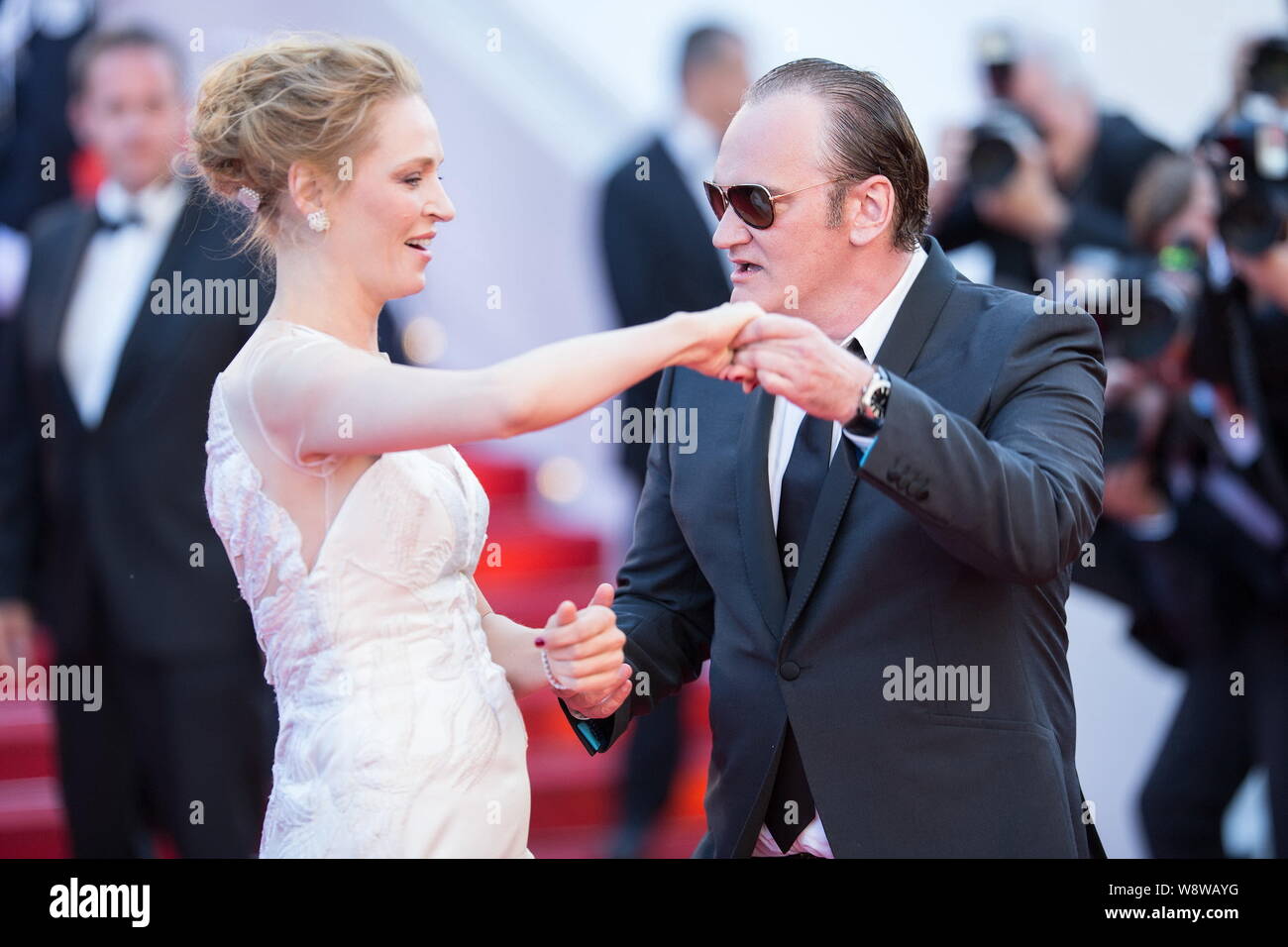 American actress Uma Thurman, left, and director Quentin Tarantino pose for photos as they arrive at the red carpet for the closing ceremony of the 67 Stock Photo