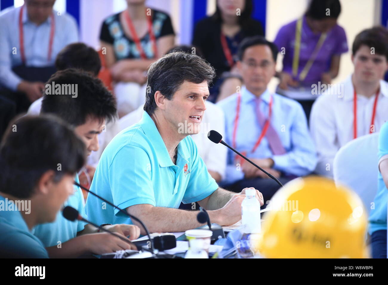 Timothy Shriver, center, Chairman of Special Olympics, speaks at the Young Leaders Roundtable meeting during the Boao Forum for Asia Annual Conference Stock Photo