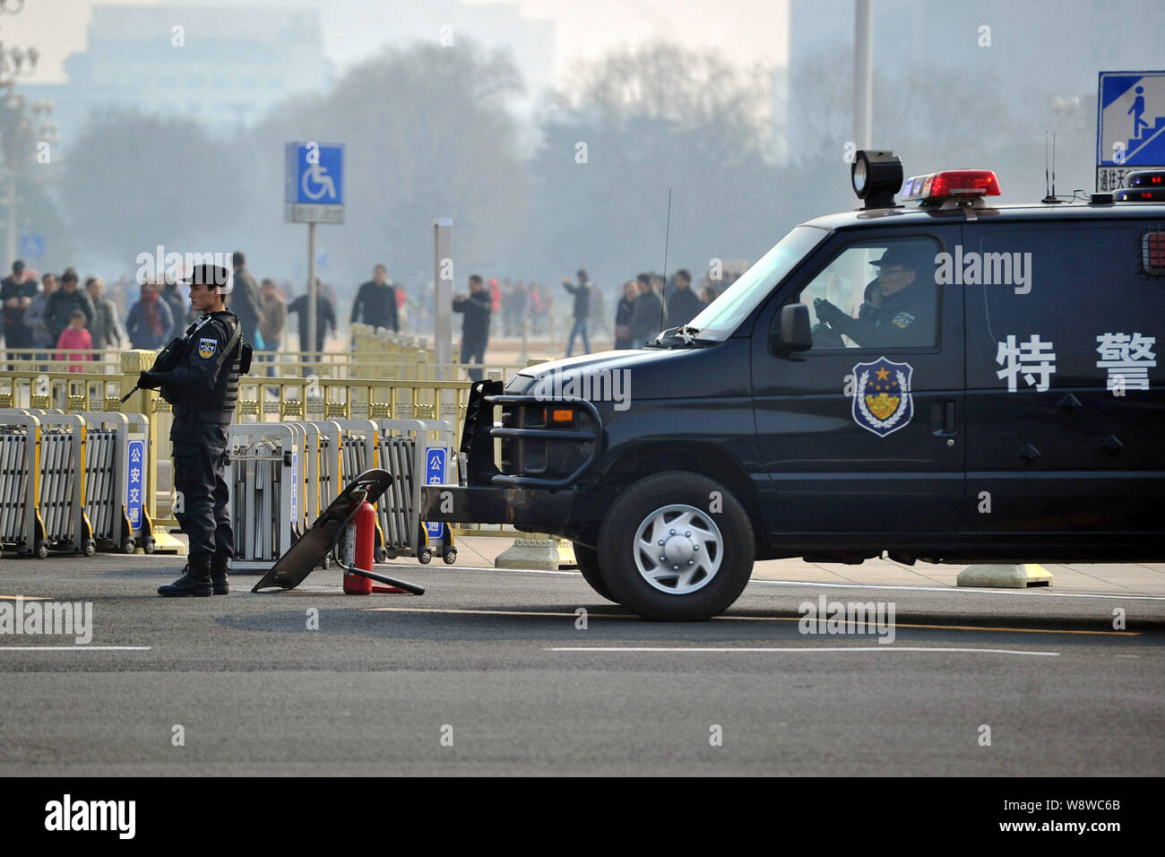 An armed police officer stands hi-res stock photography and images - Alamy