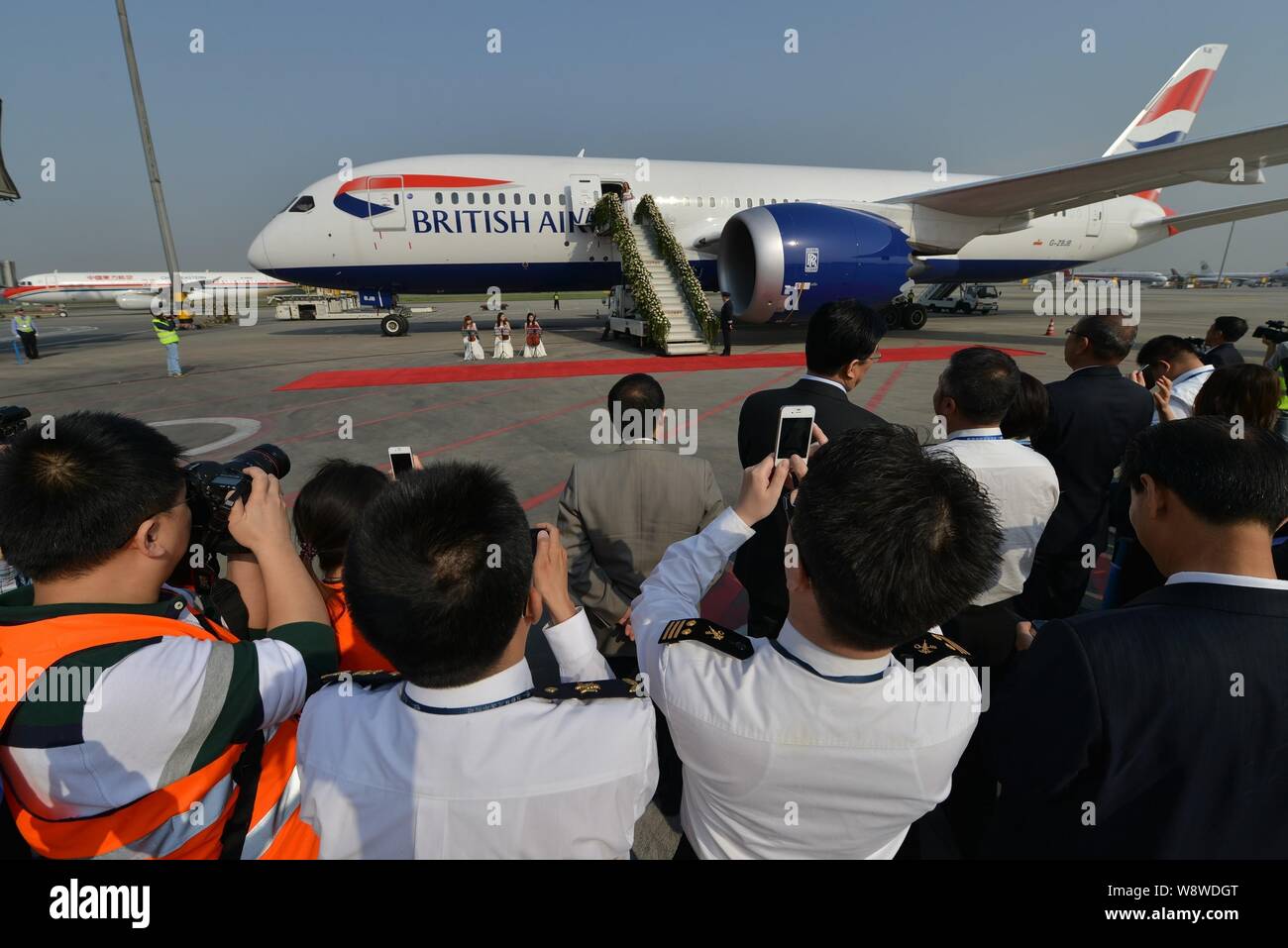 Cabin Crew Members And Journalists Take Photos Of A New