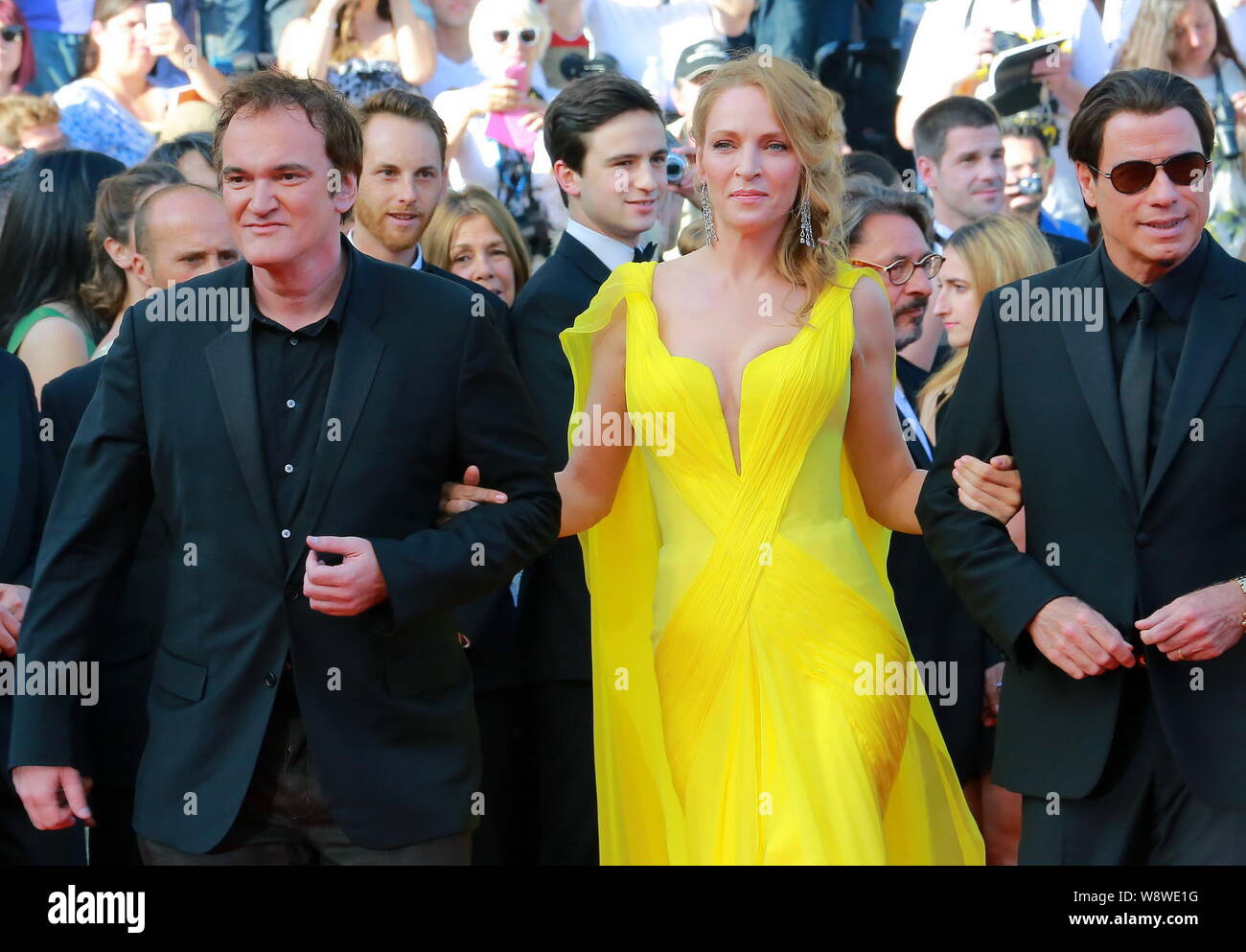 (From left) American actor Quentin Tarantino, actress Uma Thurman and actor John Travolta pose at a premiere for the movie, Clouds of Sils Maria, duri Stock Photo
