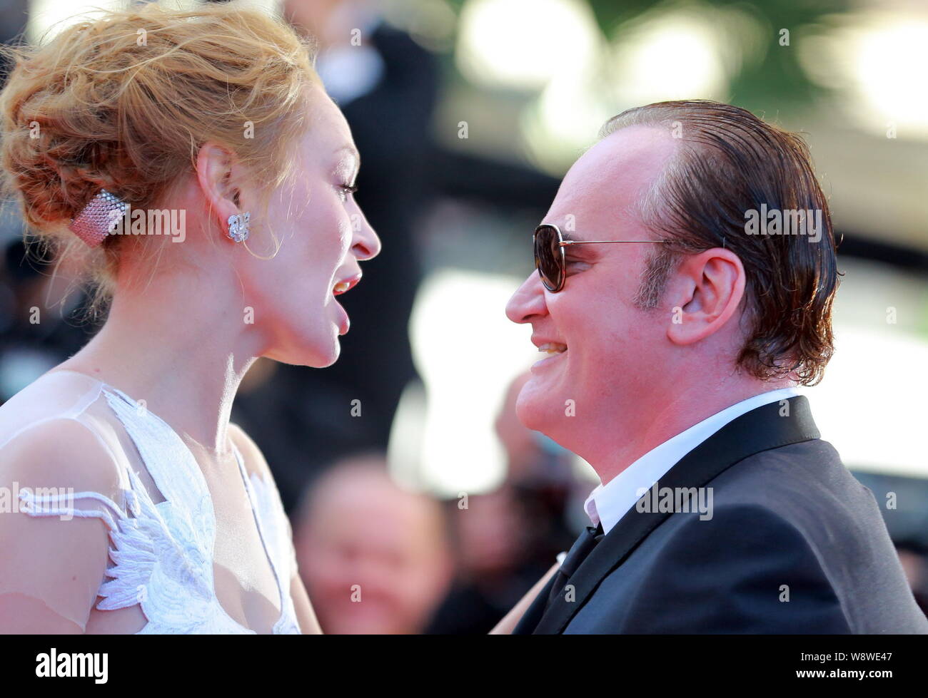 American actress Uma Thurman, left, talks with director Quentin Tarantino as they arrive at the red carpet for the closing ceremony of the 67th Cannes Stock Photo