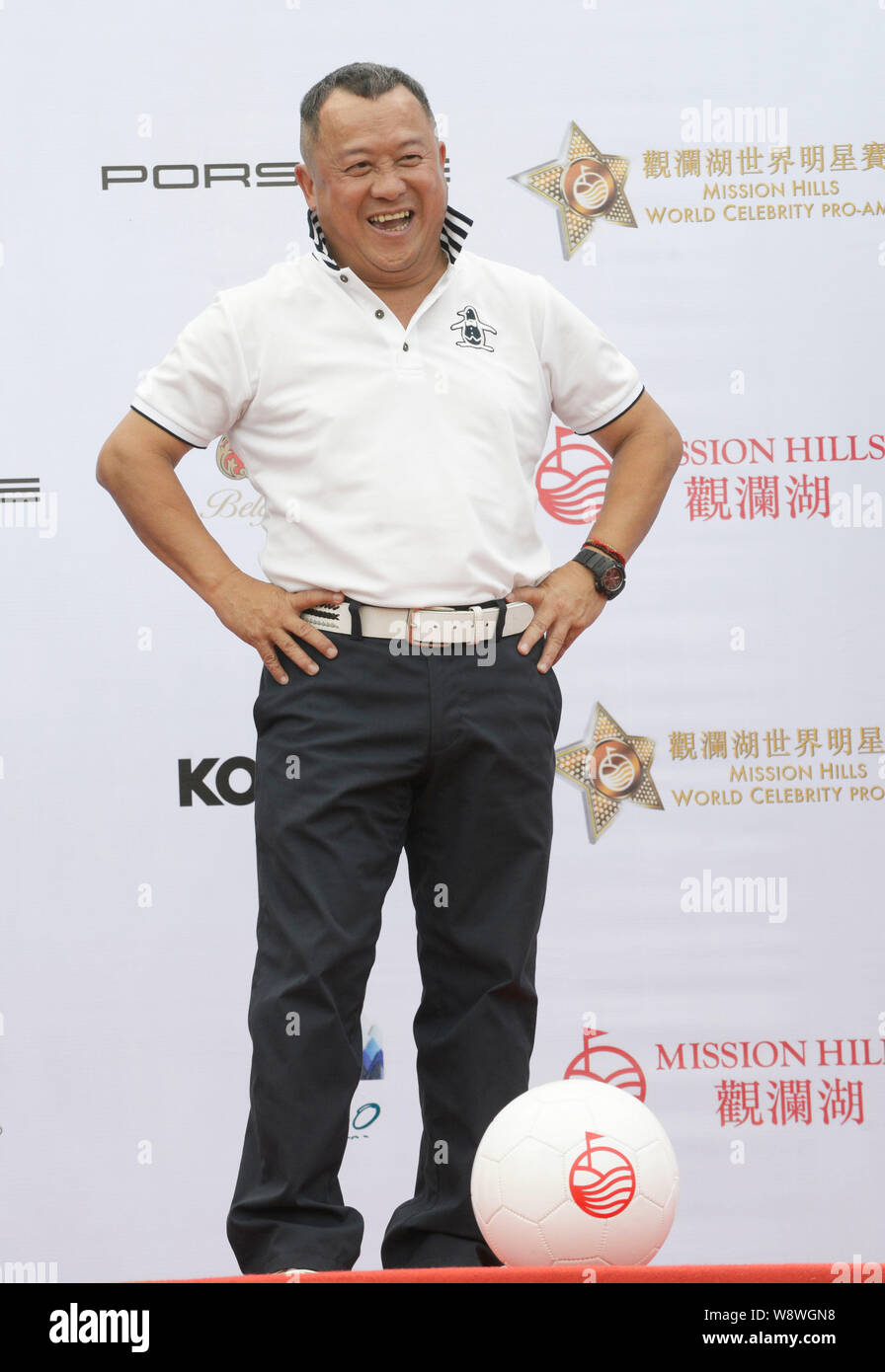 Hong Kong actor Eric Tsang laughs during a press conference for the 2014 Mission Hills World Celebrity Pro-Am in Dongguan city, south Chinas Guangdong Stock Photo