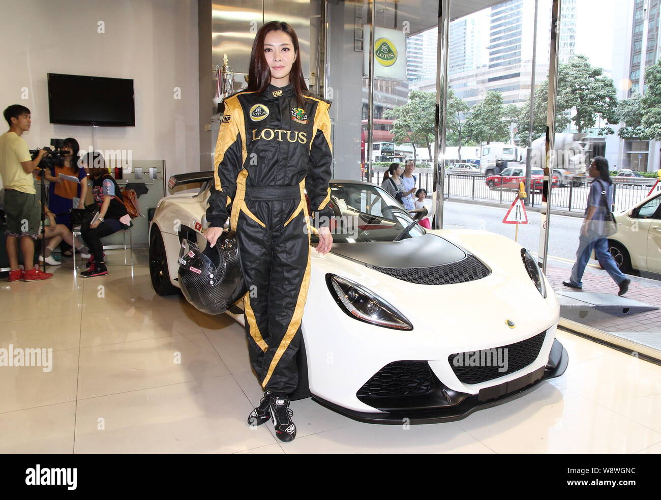 Hong Kong Model And Actress Lynn Hung Poses With A Racing Car During A Signing Ceremony For Her Competition In Lotus Greater China Races In Hong Kong Stock Photo Alamy