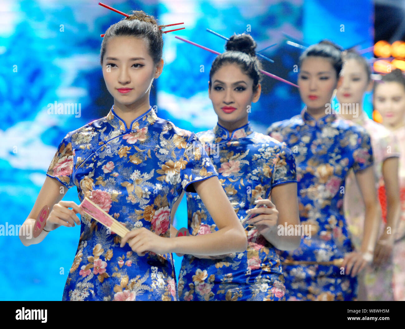 South Korean model Park Min-young, front, and other foreign models display creations of cheongsam, also known as qipao in Chinese, in the final contes Stock Photo