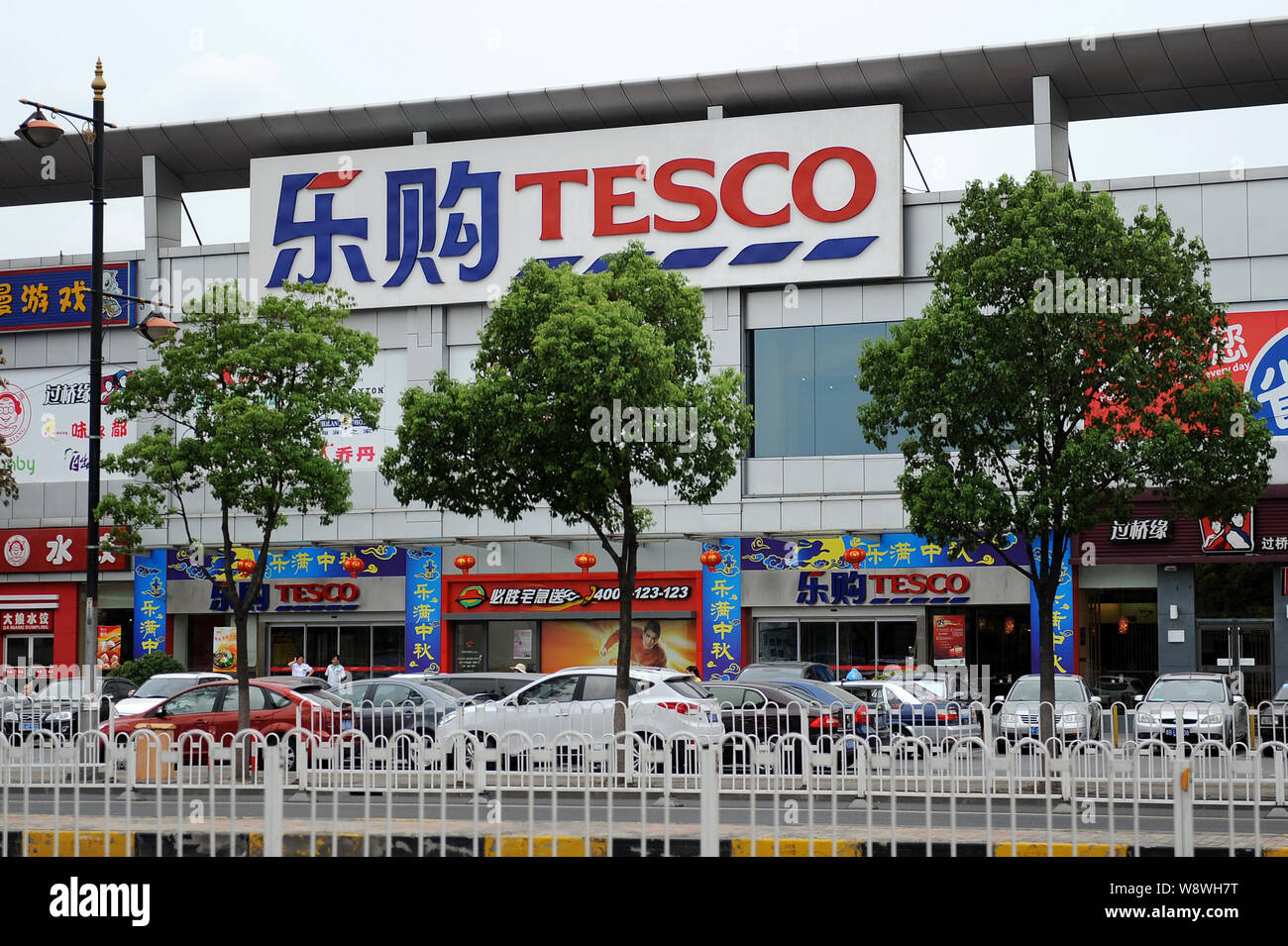 FILEVehicles run past a Tesco supermarket in Shanghai, China, 18