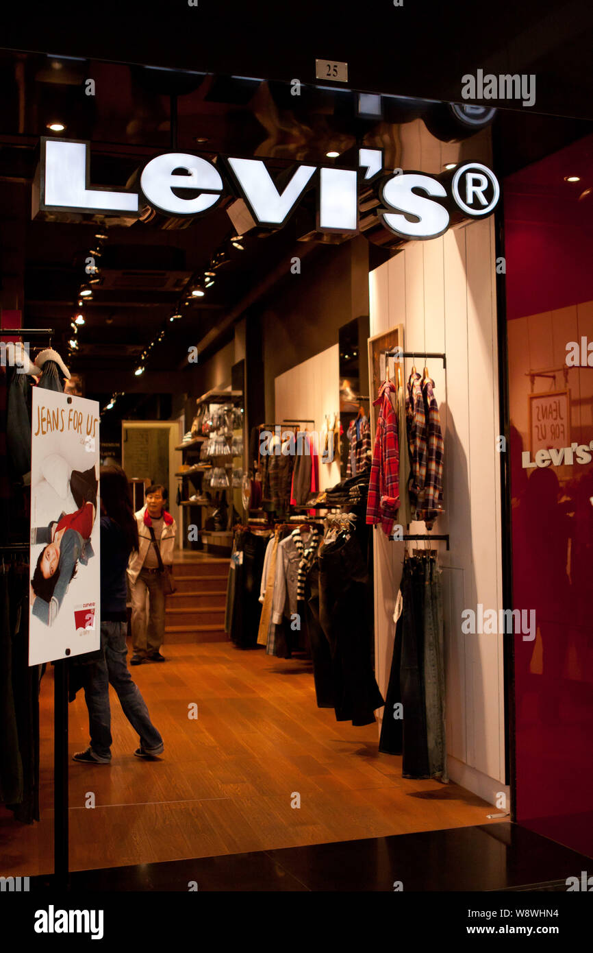 FILE--Customers shop at a of Levis in Macau, China, December 2011. one of the worlds most famous jeans makers, has had a falling ou Stock Photo -
