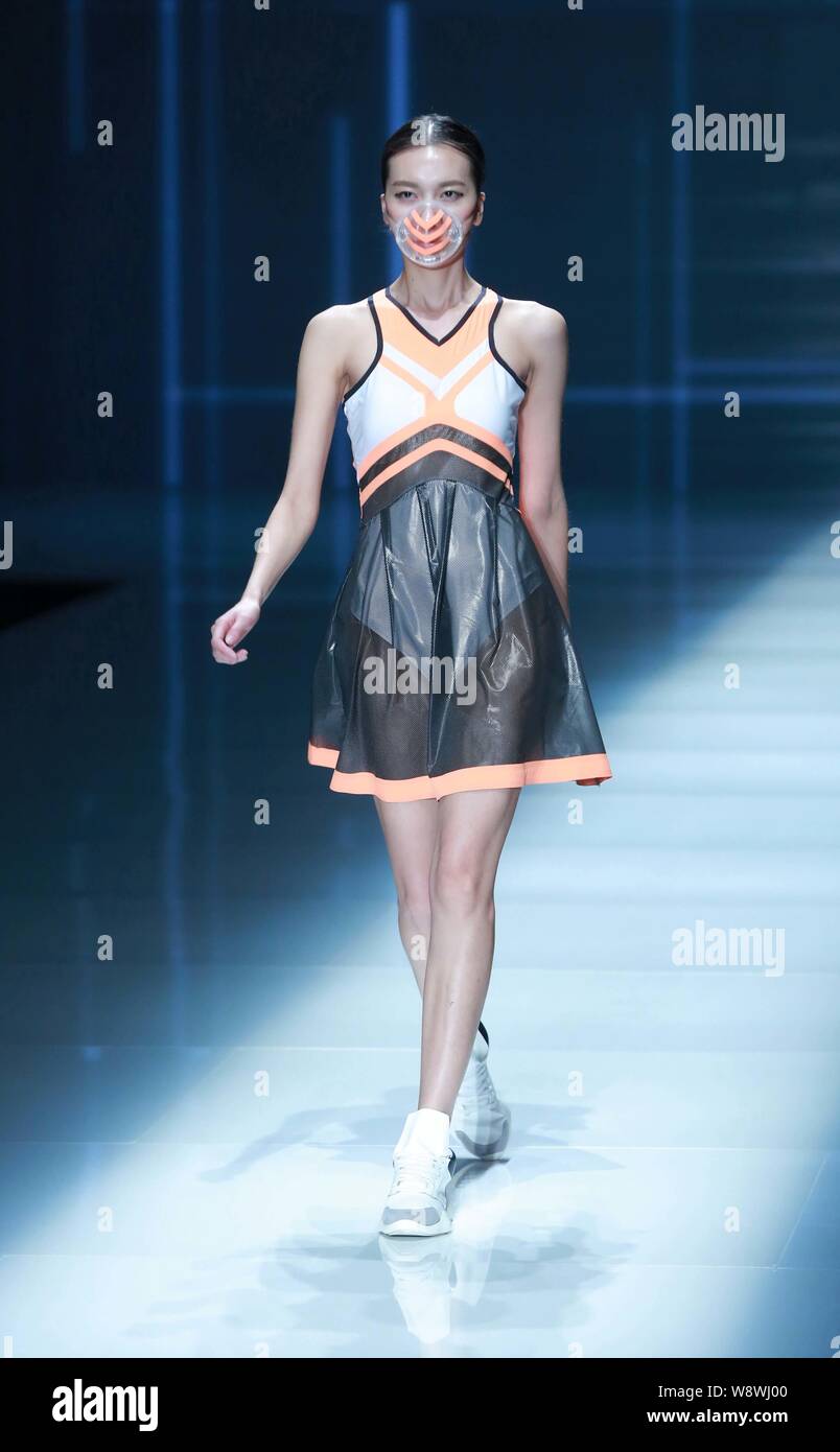 A model displays a new creation by designer Yi Peng at the Qiaodan Yi Peng fashion show during the China Fashion Week Spring/Summer 2015 in Beijing, C Stock Photo