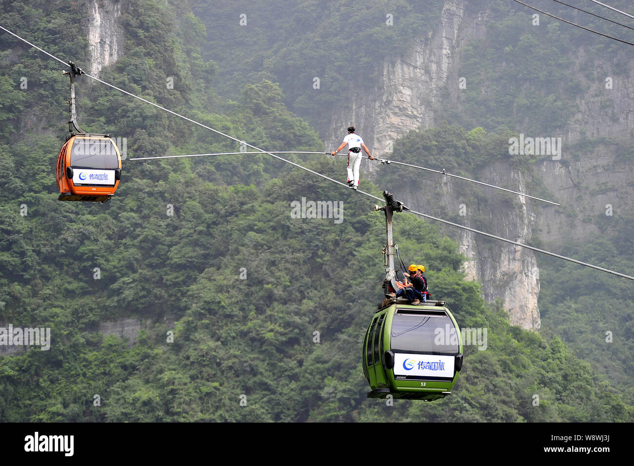 Swiss acrobat Freddy Nock is pictured carrying a balancing pole during an  attempt to walk along the 743-meter-long cableway without protection at  Tian Stock Photo - Alamy