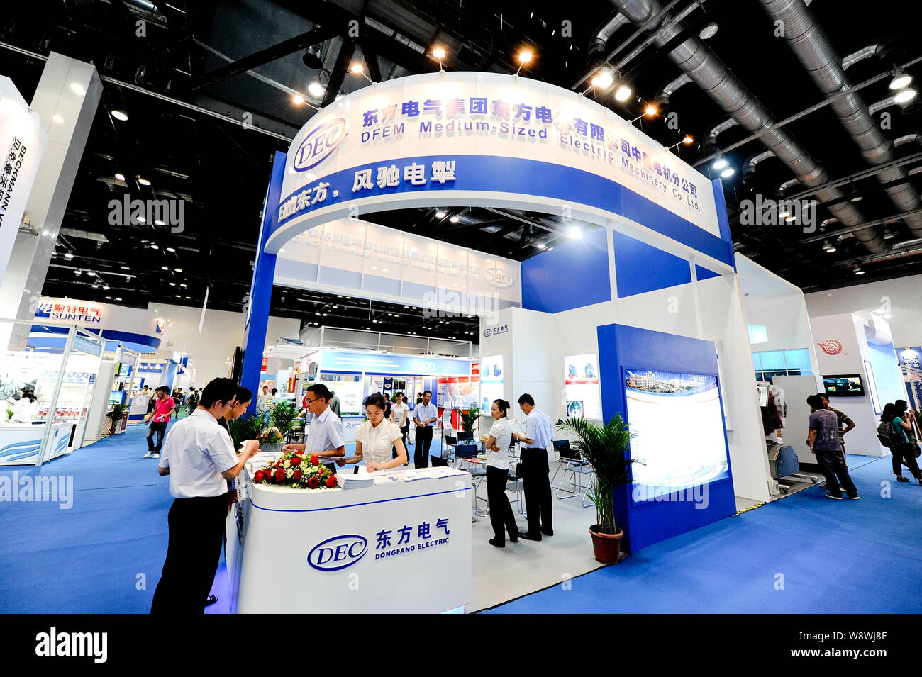 --FILE--People visit the stand of Dongfang Electric Corporation (DEC) during the 2011 Clean Energy China Exhibition in Beijing, China, 22 June 2011. Stock Photo