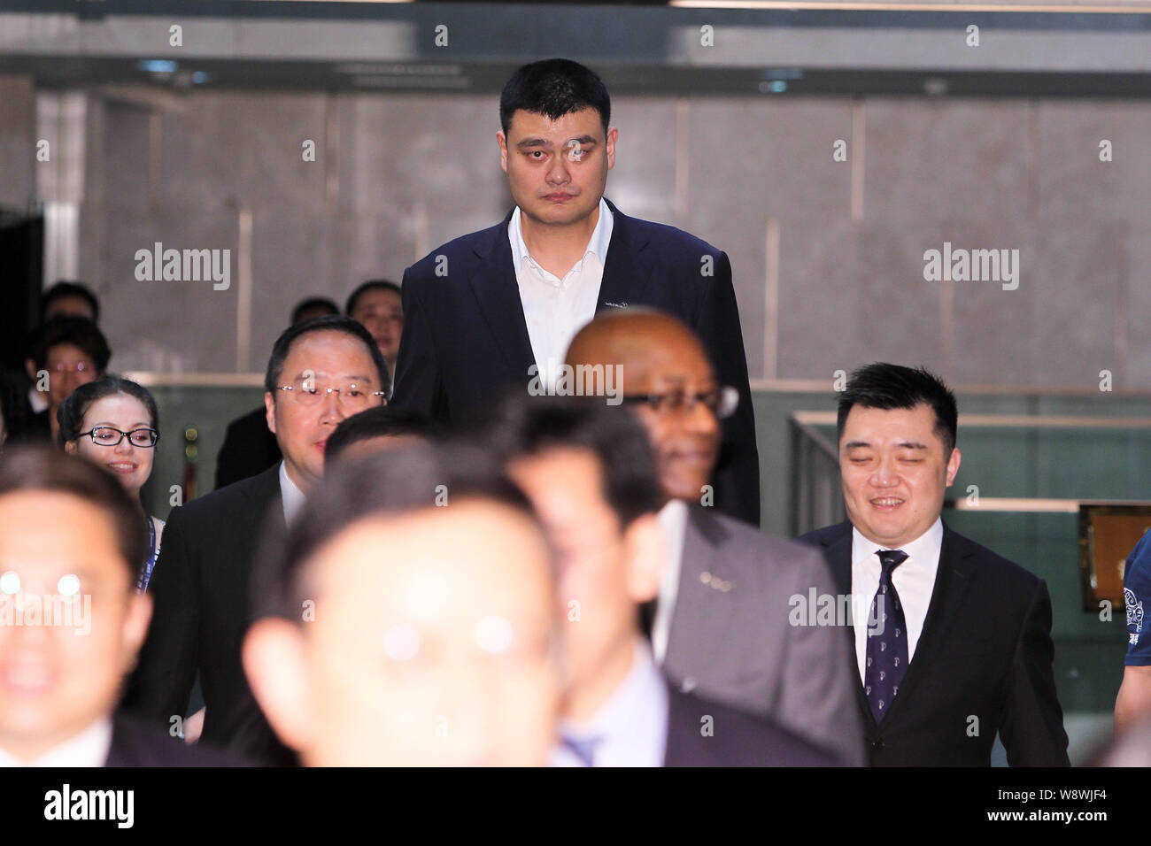 Retired Chinese basketball superstar Yao Ming, back tallest, is pictured as he arrives at a press conference for the 2015 Laureus World Sports Awards Stock Photo