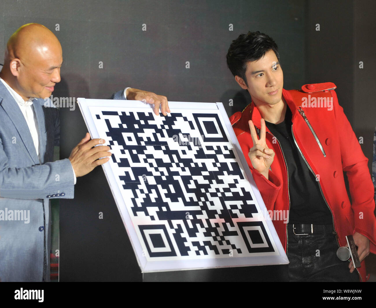 Taiwanese singer Leehom Wang, right, poses during a press conference for his MUSIC-MAN II world tour concert in Beijing, China, 8 May 2014.   As the f Stock Photo