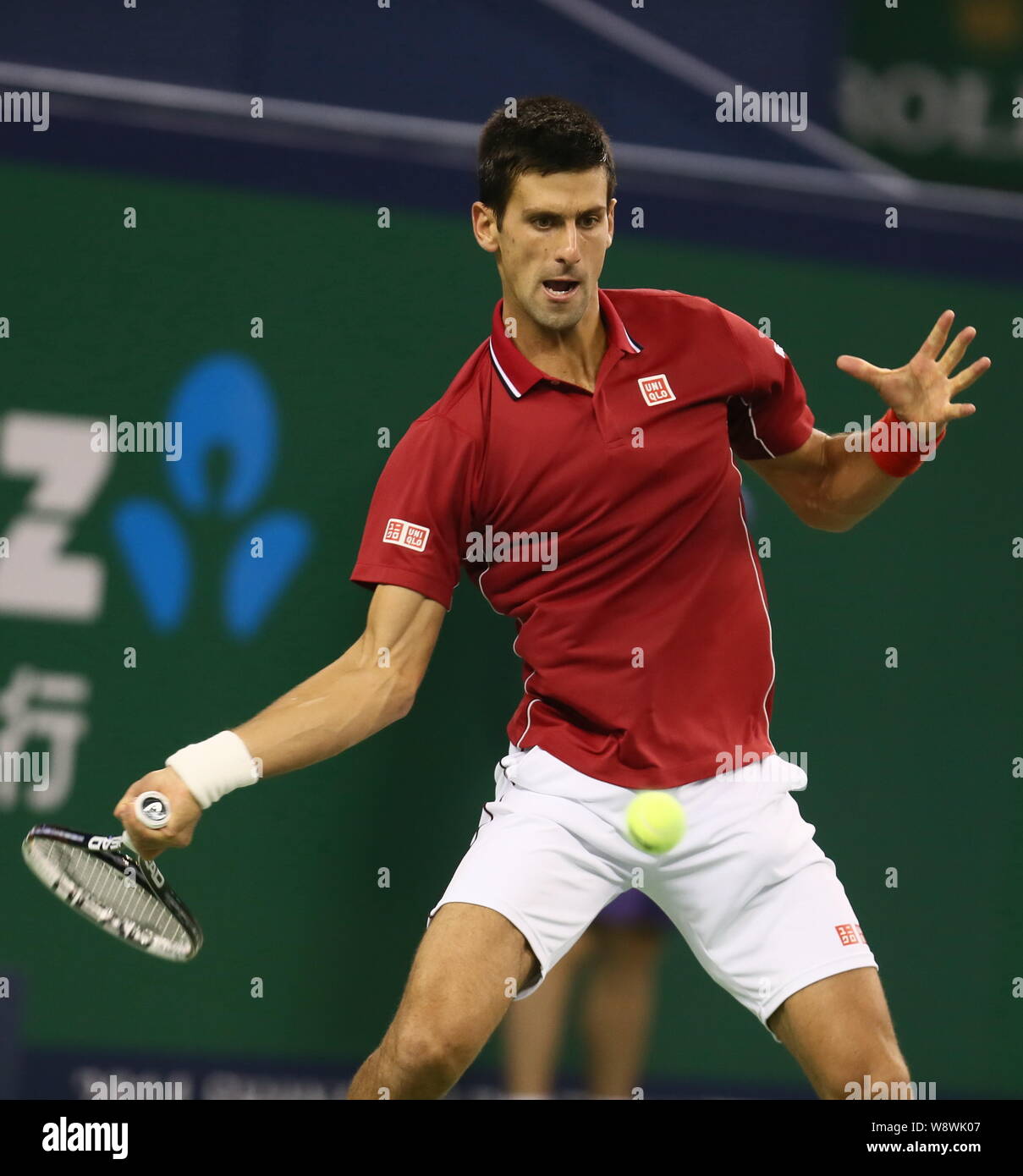 Novak Djokovic of Serbia returns a shot to Roger Federer of Switzerland in  the semi-finals of the men's singles during the 2014 Shanghai Rolex Masters  Stock Photo - Alamy