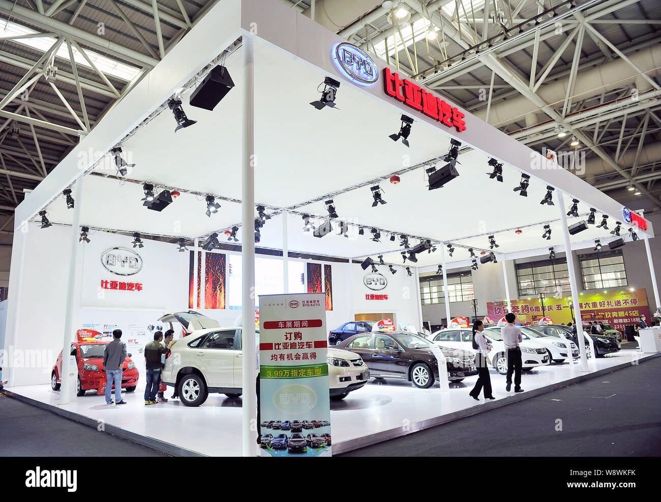 --FILE--People visit the stand of BYD during an automobile exhibition ...