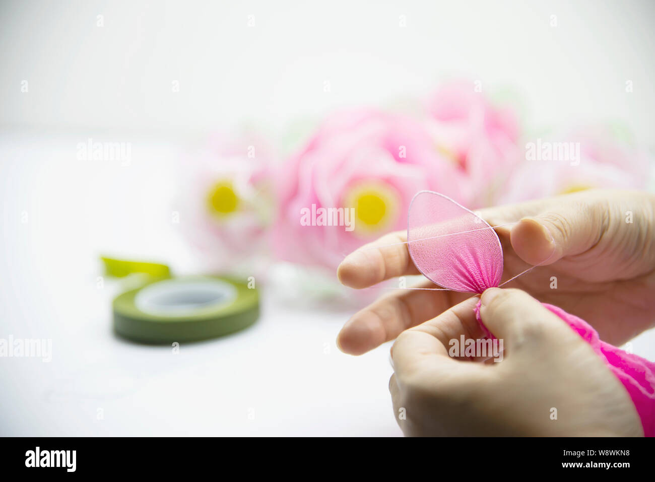 Woman making beautiful nylon flower - people with DIY handmade flower concept Stock Photo