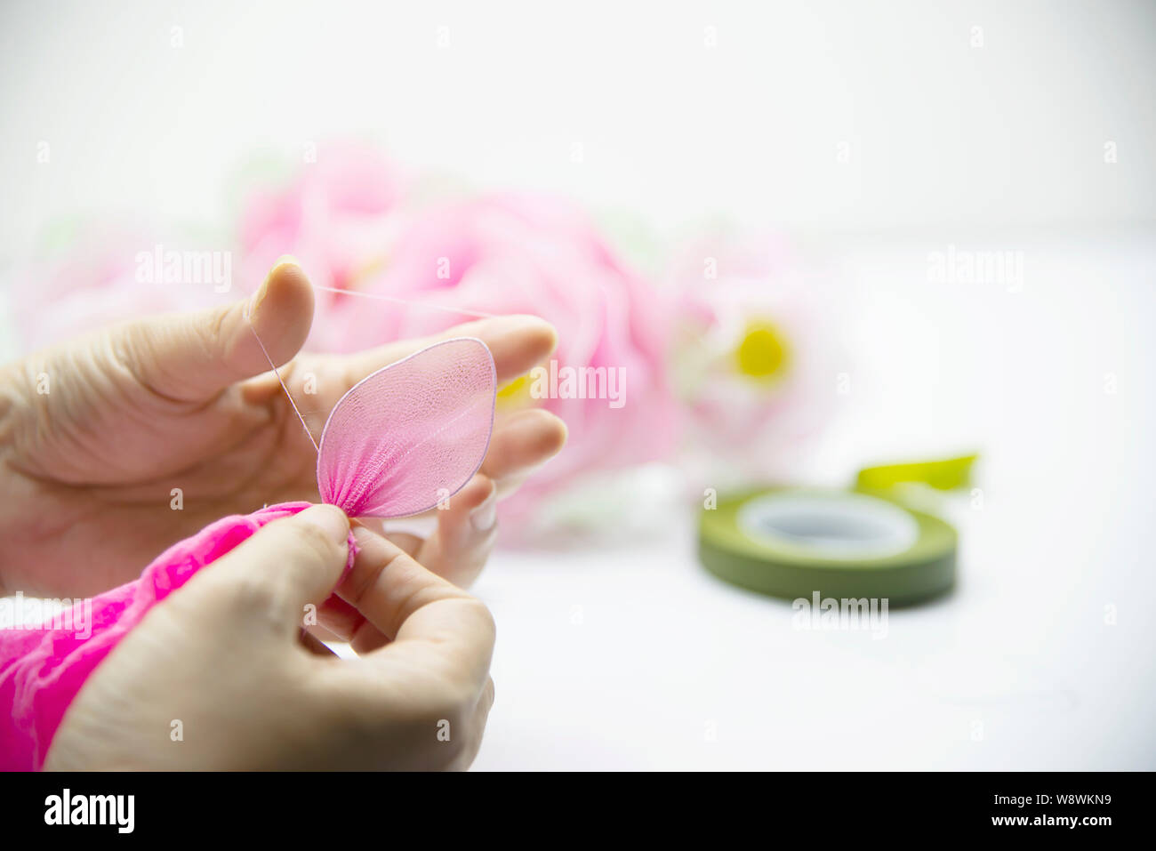 Woman making beautiful nylon flower - people with DIY handmade flower concept Stock Photo