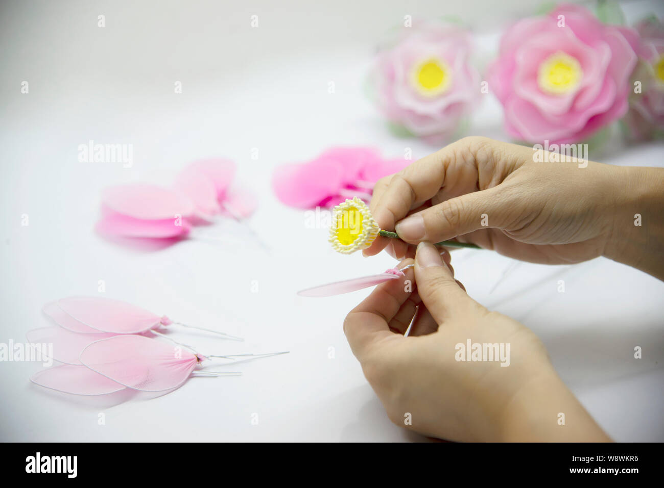 Woman making beautiful nylon flower - people with DIY handmade flower concept Stock Photo