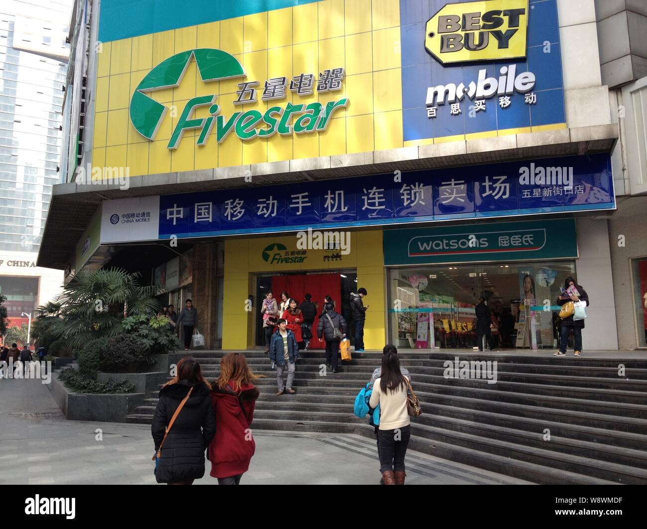 File Pedestrians Walk Past A Five Star Appliance And Best Buy