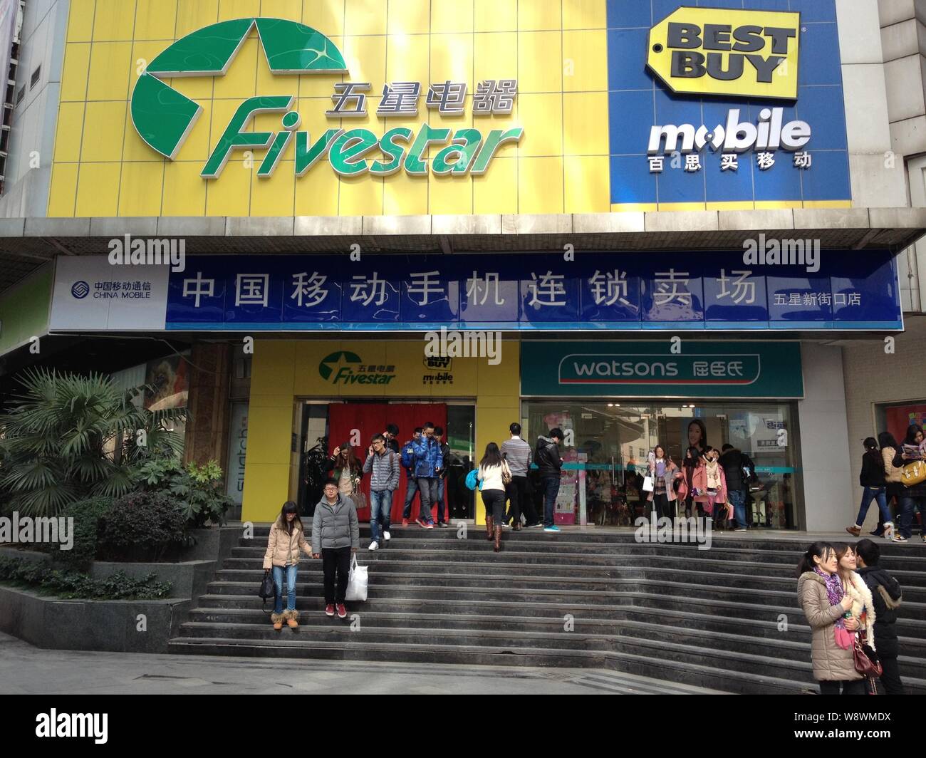 File Pedestrians Walk Past A Five Star Appliance And Best Buy