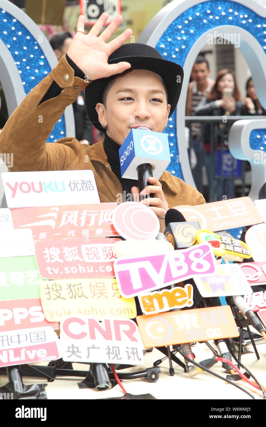 Dong Young-bae, better known by his stage name Taeyang, of South Korean boy band BigBang, waves at the opening ceremony of Tsim Sha Tsui Sogo in Hong Stock Photo