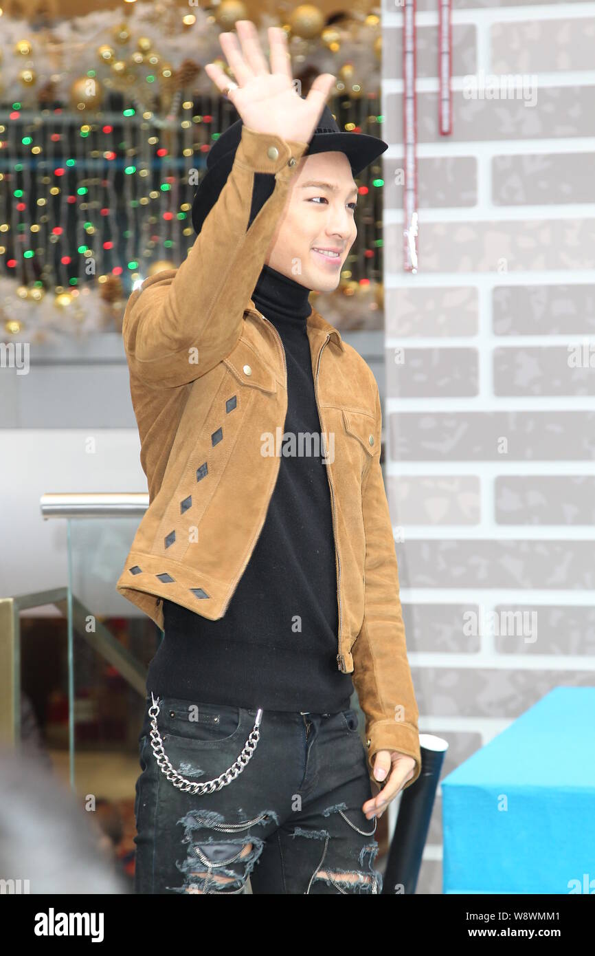 Dong Young-bae, better known by his stage name Taeyang, of South Korean boy band BigBang, waves at the opening ceremony of Tsim Sha Tsui Sogo in Hong Stock Photo