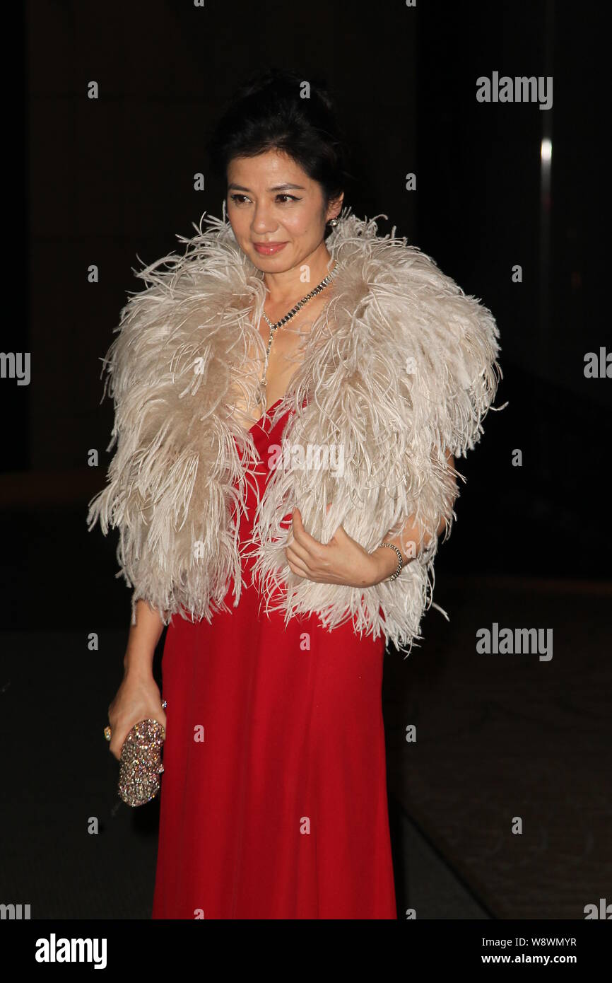 Hong Kong actress Cherie Chung smiles as she arrives for Carina Lau’s