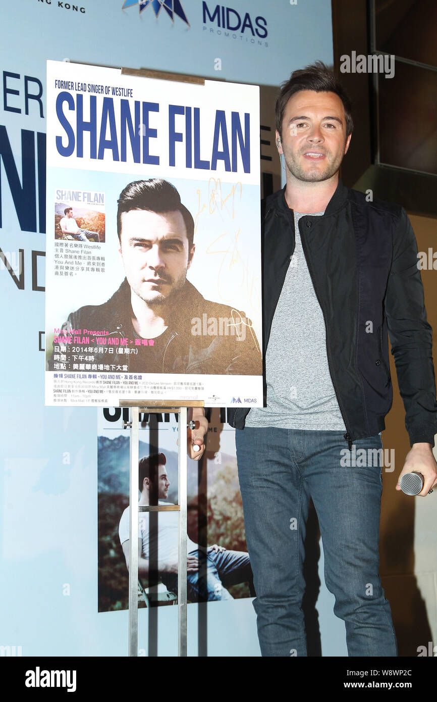 Shane Filan, former lead singer of Irish boy group Westlife, poses with his poster at a signing event for his new album, You And Me, in Taipei, Taiwan Stock Photo