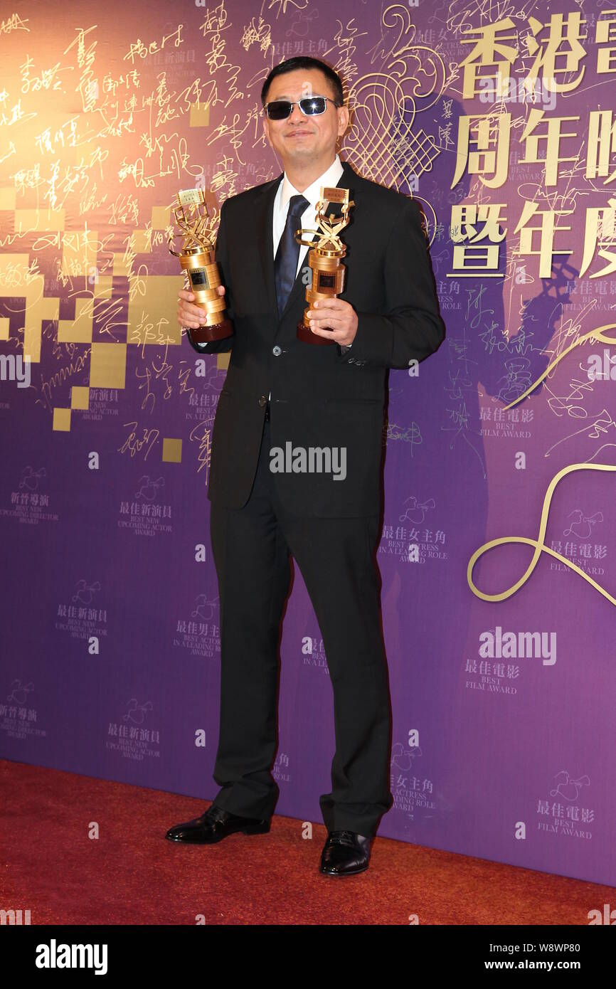 Hong Kong director Wong Kar-Wai poses with his trophies for Best ...
