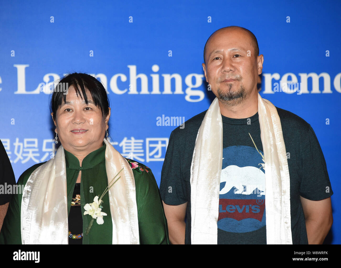 Chinese director Mai Lisi, left, and singer Tengri pose during the launching ceremony for the Sino-US co-production of historical epic in 3D 'Genghis Stock Photo