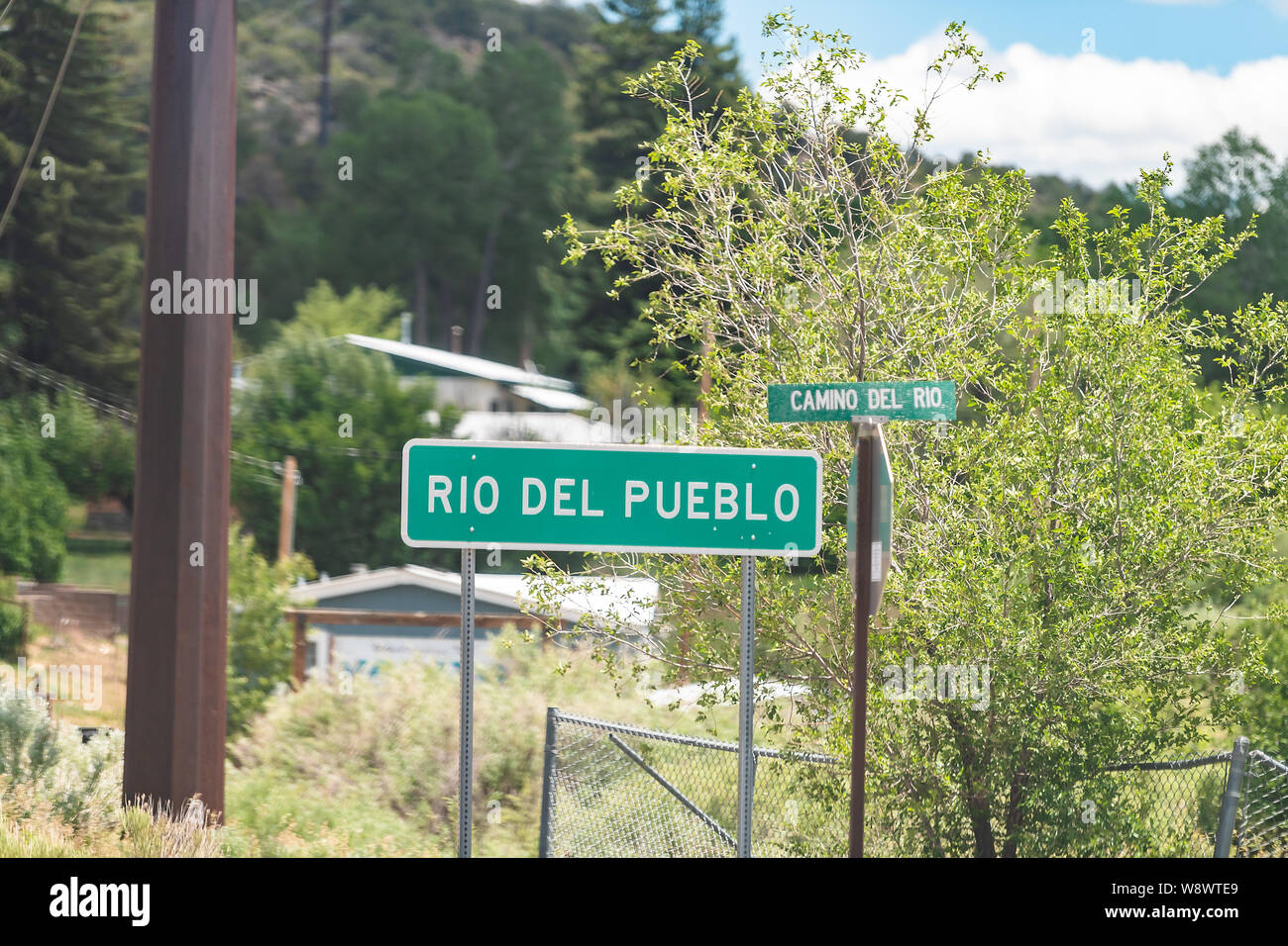 Rio del Pueblo village sign in High Road to Taos historic town street