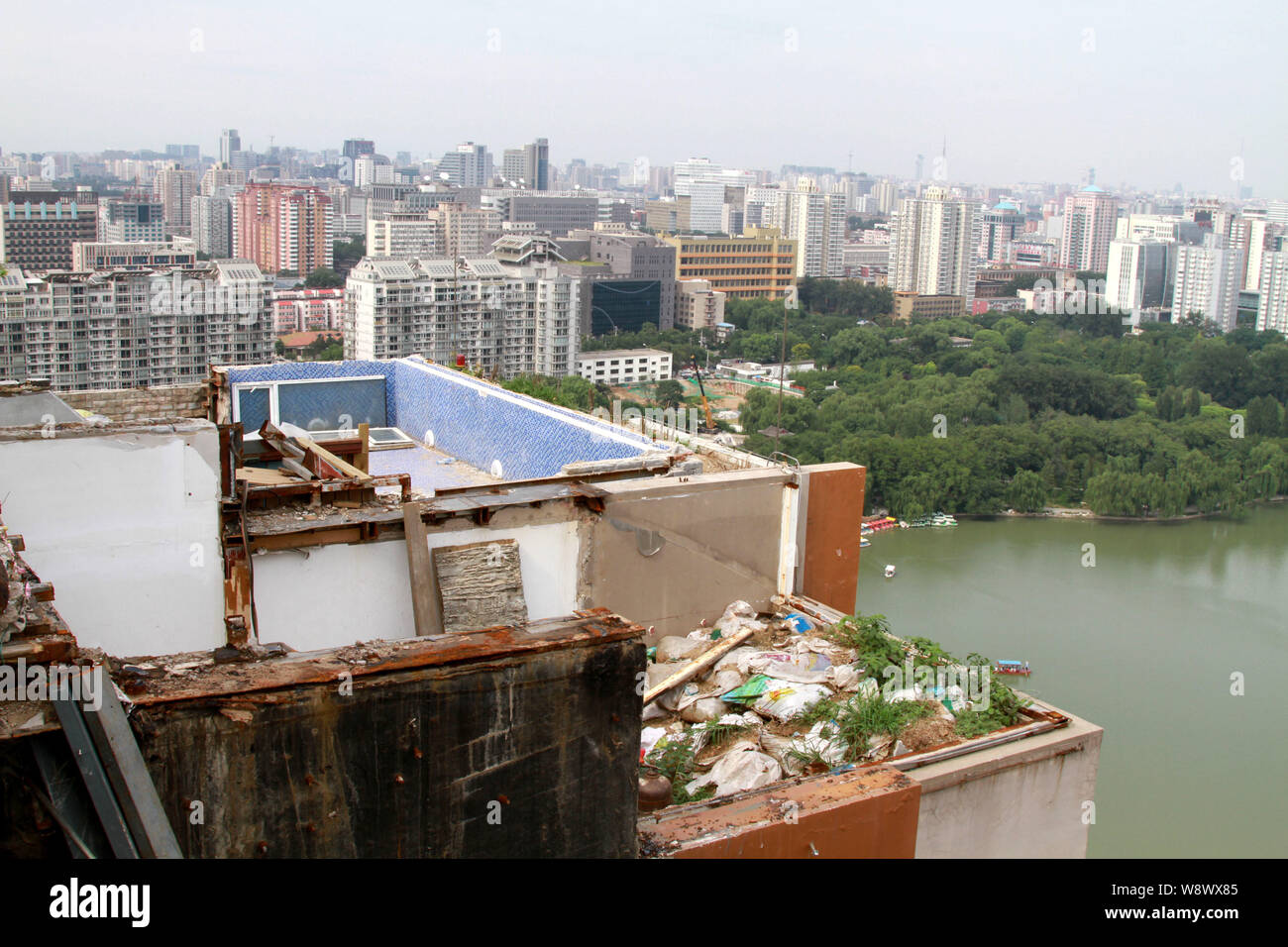 View Of Bags Of Litter And The Demolished Illegal Rooftop Villa Which ...