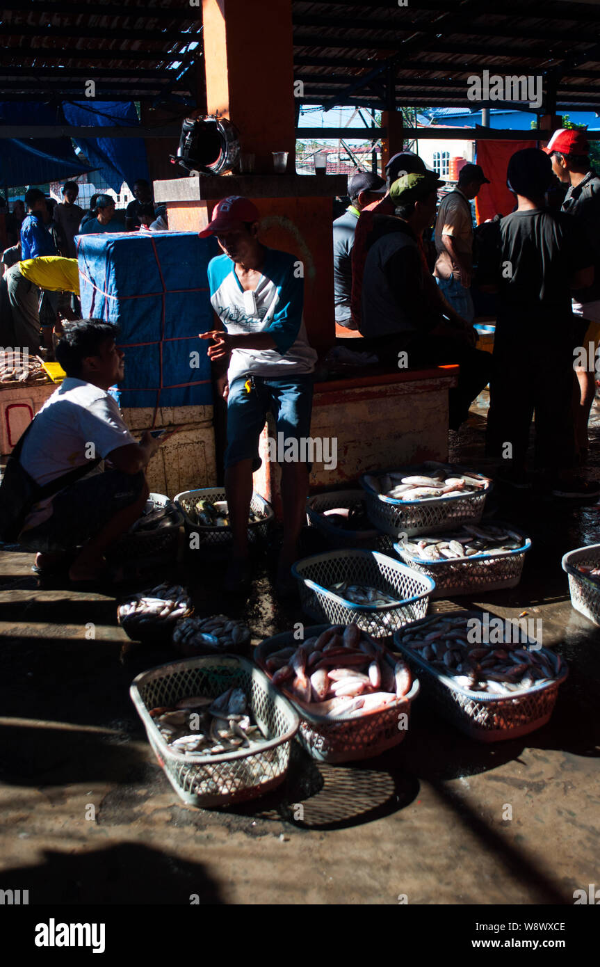 People interact at Paotere Fish Merket in Makassar. Indonesia has become one of the largest fish product after the central government policy to sink i Stock Photo
