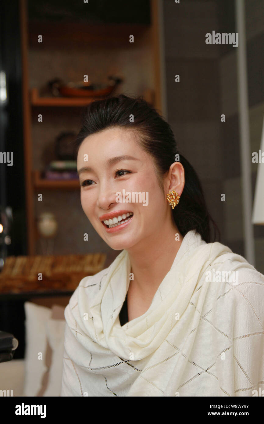 Chinese actress Qin Hailu grins as she is interviewed during a press conference for the Great Movie Tours in London, UK, 4 June 2014.   Chinese actres Stock Photo