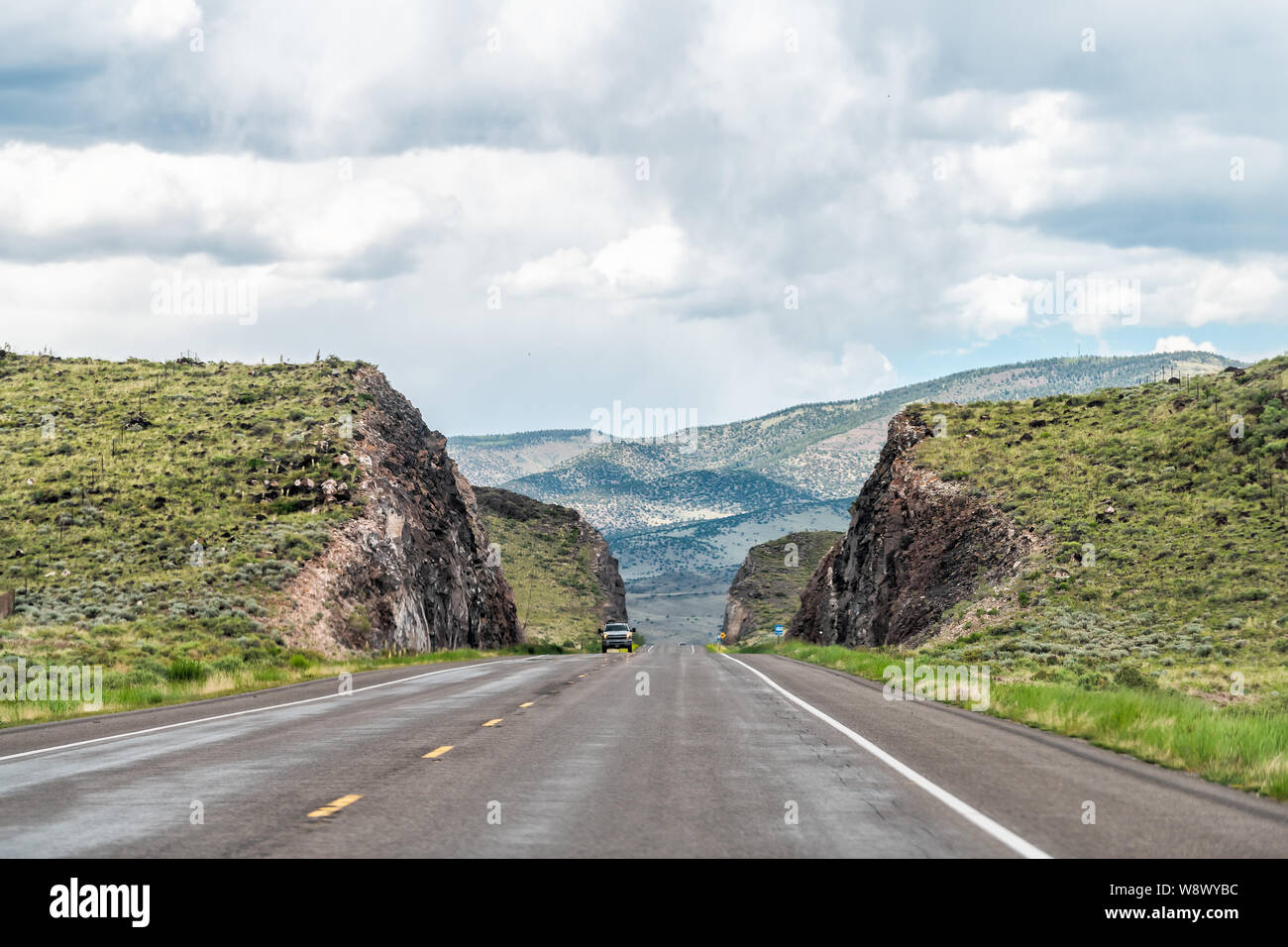 Highway 285 Near Saguache Colorado With Rural Countryside And Canyon highway-285-near-saguache-colorado-with-rural-countryside-and-canyon