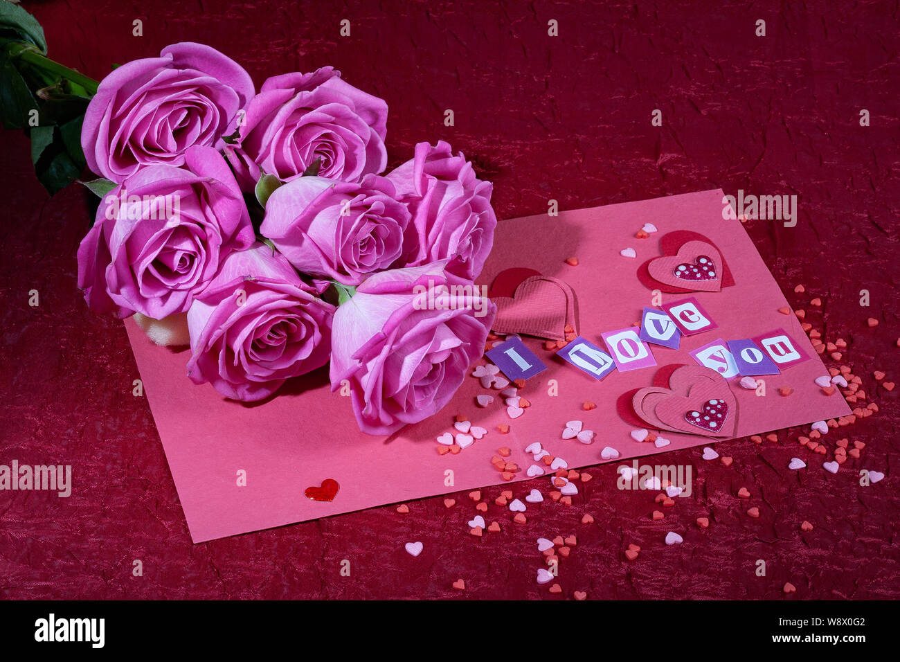 Roses and letters on a studio background Stock Photo - Alamy