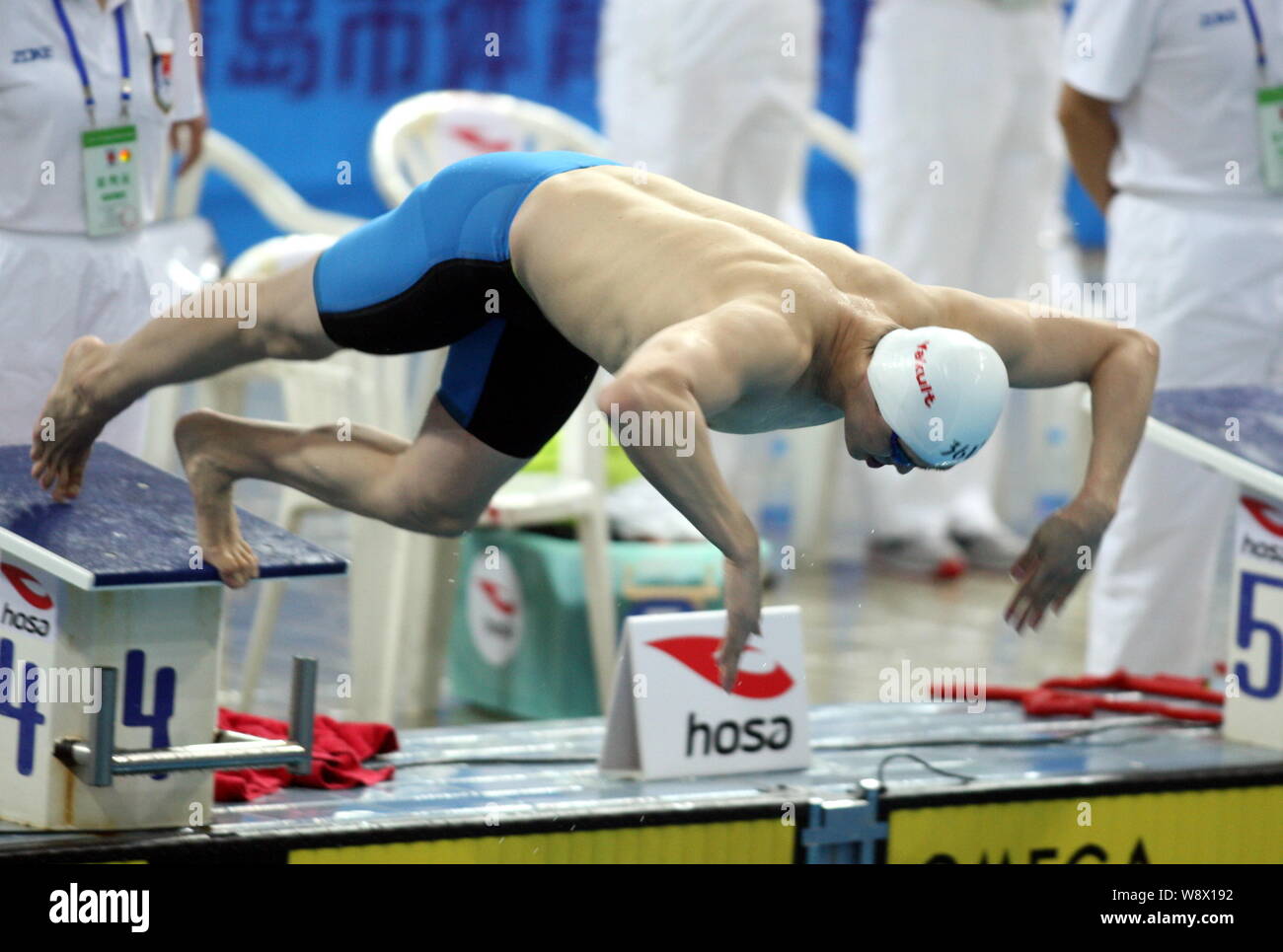 Chinese swimming champion Sun Yang jumps into the pool during the mens ...