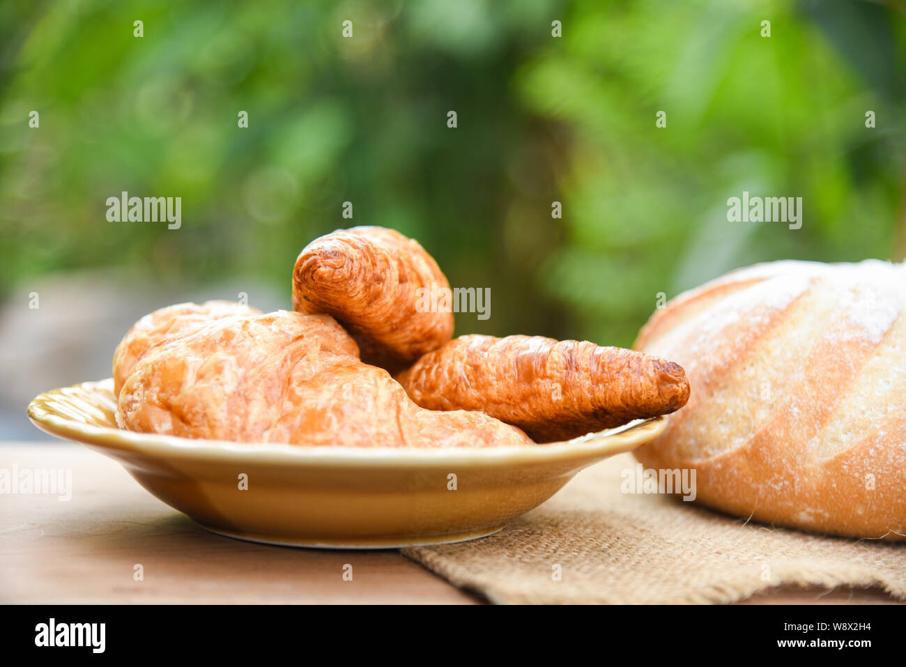 freshly baked croissants / Bakery bread on sack in the table homemade