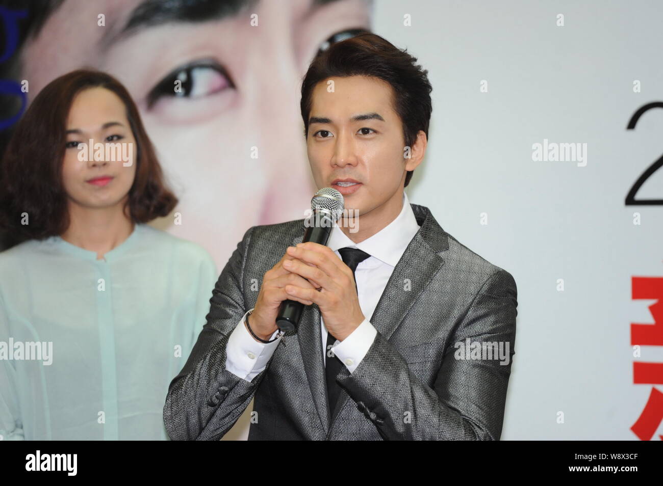 South Korean actor Song Seung-heon speaks at a fan meeting in Beijing, China, 22 August 2014. Stock Photo