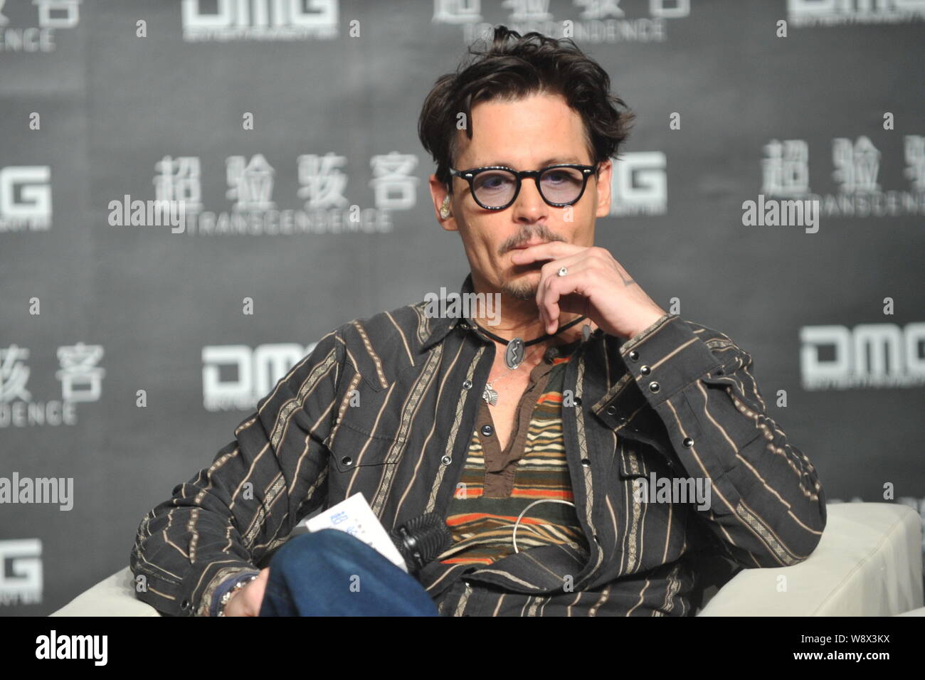 American actor Johnny Depp attends a press conference for his movie, Transcendence, in Beijing, China, 31 March 2014. Stock Photo