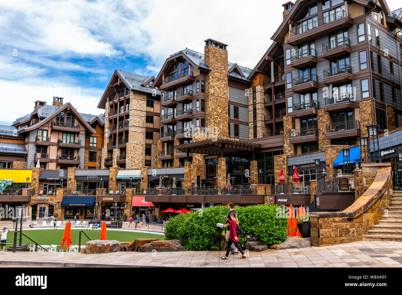 Vail, USA - June 29, 2019: European Swiss style resort town in Colorado with people walking by shops and Solaris hotel building Stock Photo